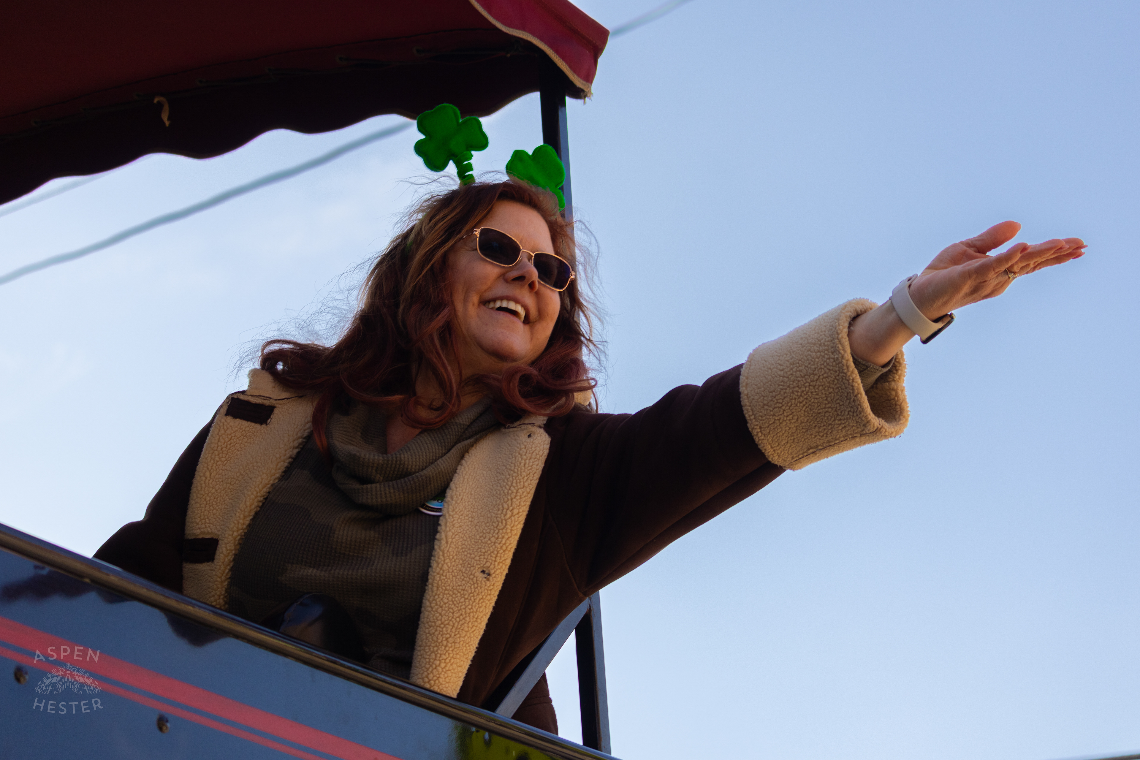 Judge Audra Eckerle Throws Beads to Spectators From The Derby City Express as The 52nd Annual Saint Patrick’s Day Parade Rolls Through The Highlands. March 8th, 2025/Aspen Hester