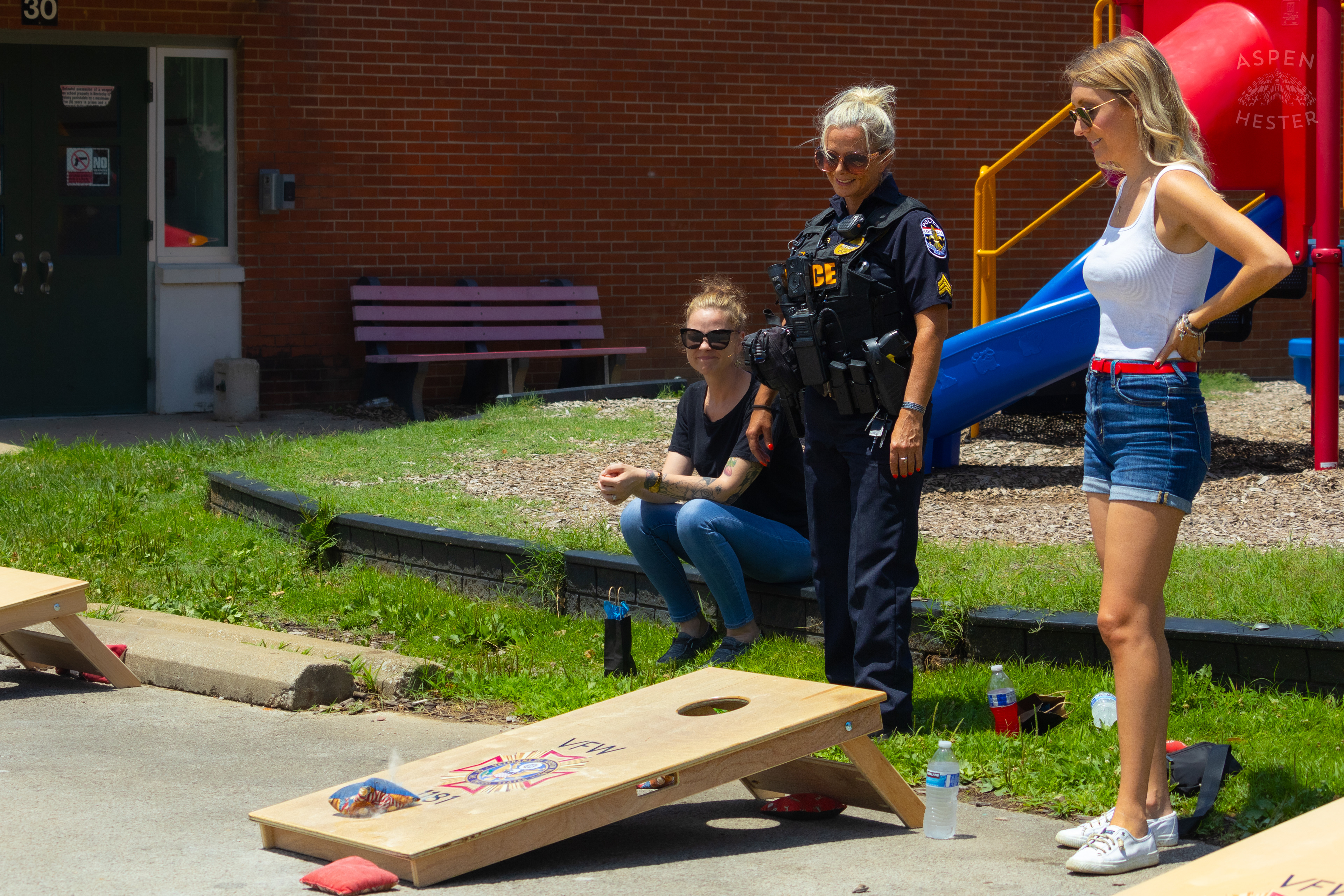 LMPD Officer Carmine Zoeller Participates in "Cornhole with Cops" Event. July 6th, 2024/Aspen Hester