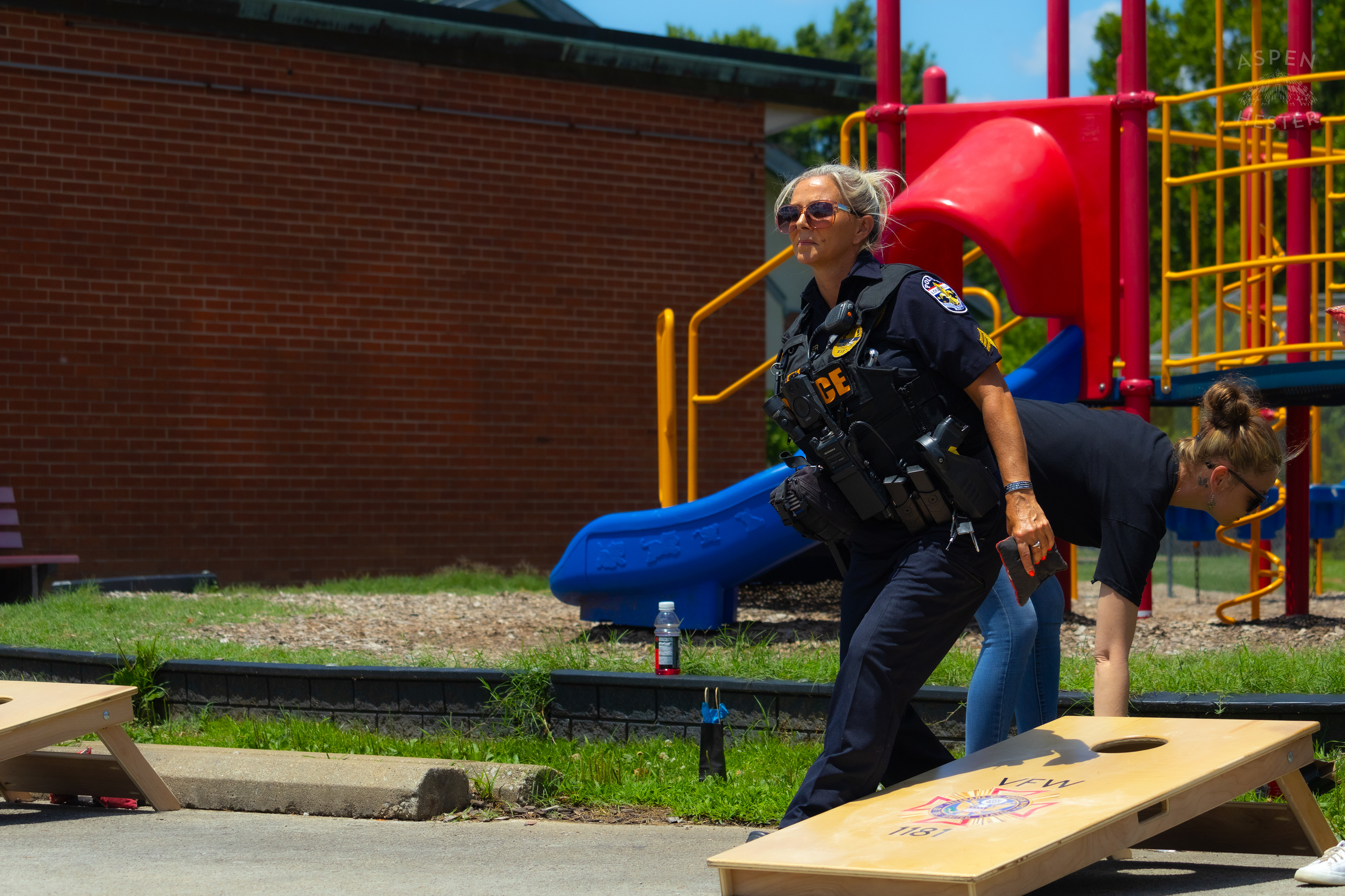 LMPD Officer Carmine Zoeller Participates in "Cornhole with Cops" Event. July 6th, 2024/Aspen Hester