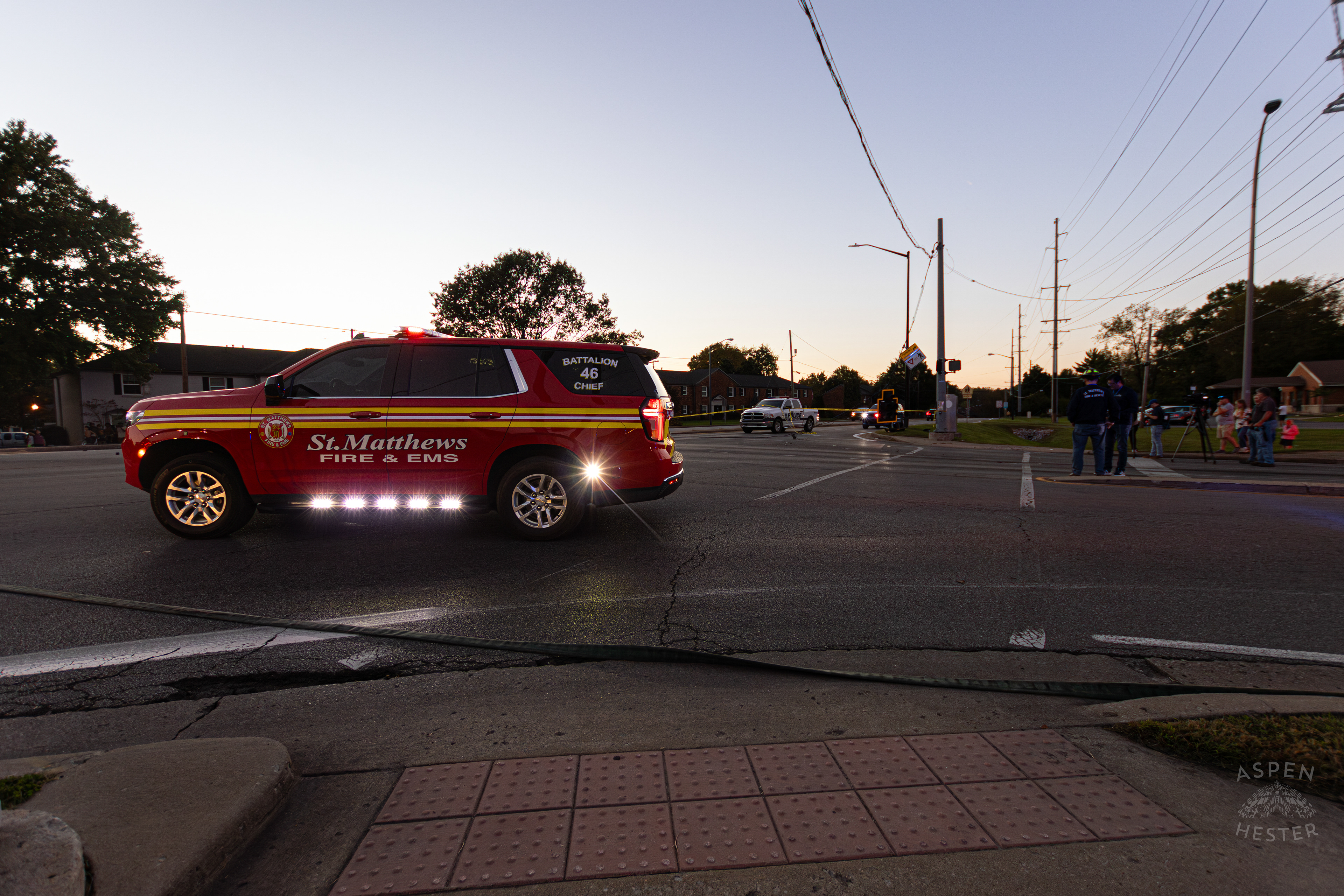 St. Matthews Fire and EMS Battalion Chief Watches Over The Scene Where A Piper Cherokee Plane Crash Landed, Taking Out Utility Poles, and Hitting A Car on Breckenridge Lane and Kresge Way. October 11th, 2024/Aspen Hester 