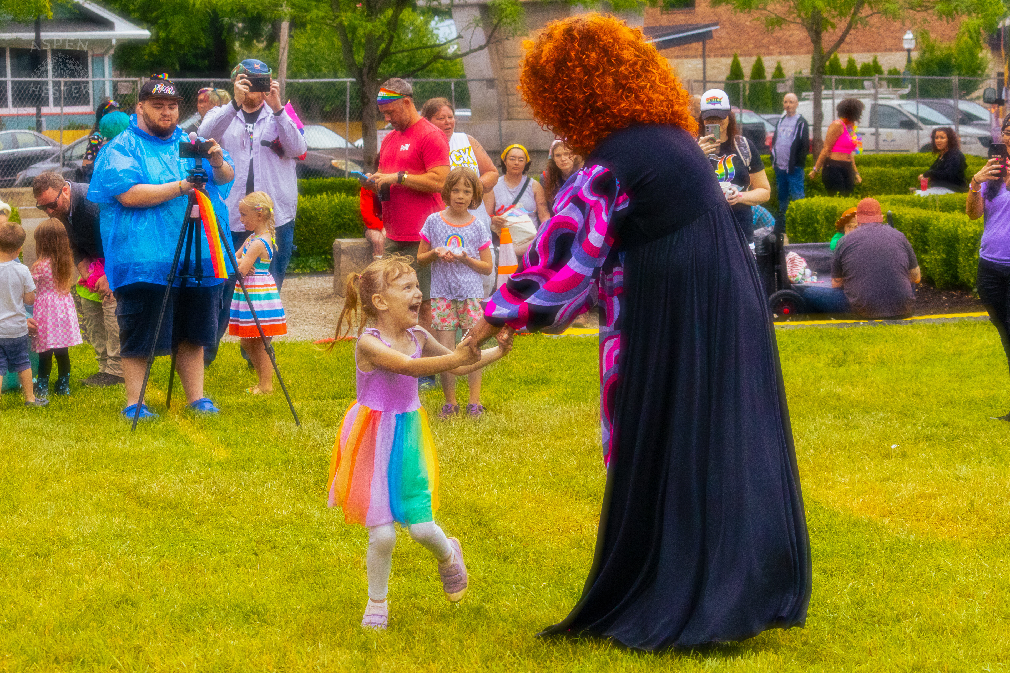 Drag Queen Dancing with A Kid from The Crowd While Performing 'Greatest Love of All' by Whitney Houston During Pride Bar's Family Friendly Drag Show at Southern Indiana Pride. June 1st, 2024/Aspen Hester