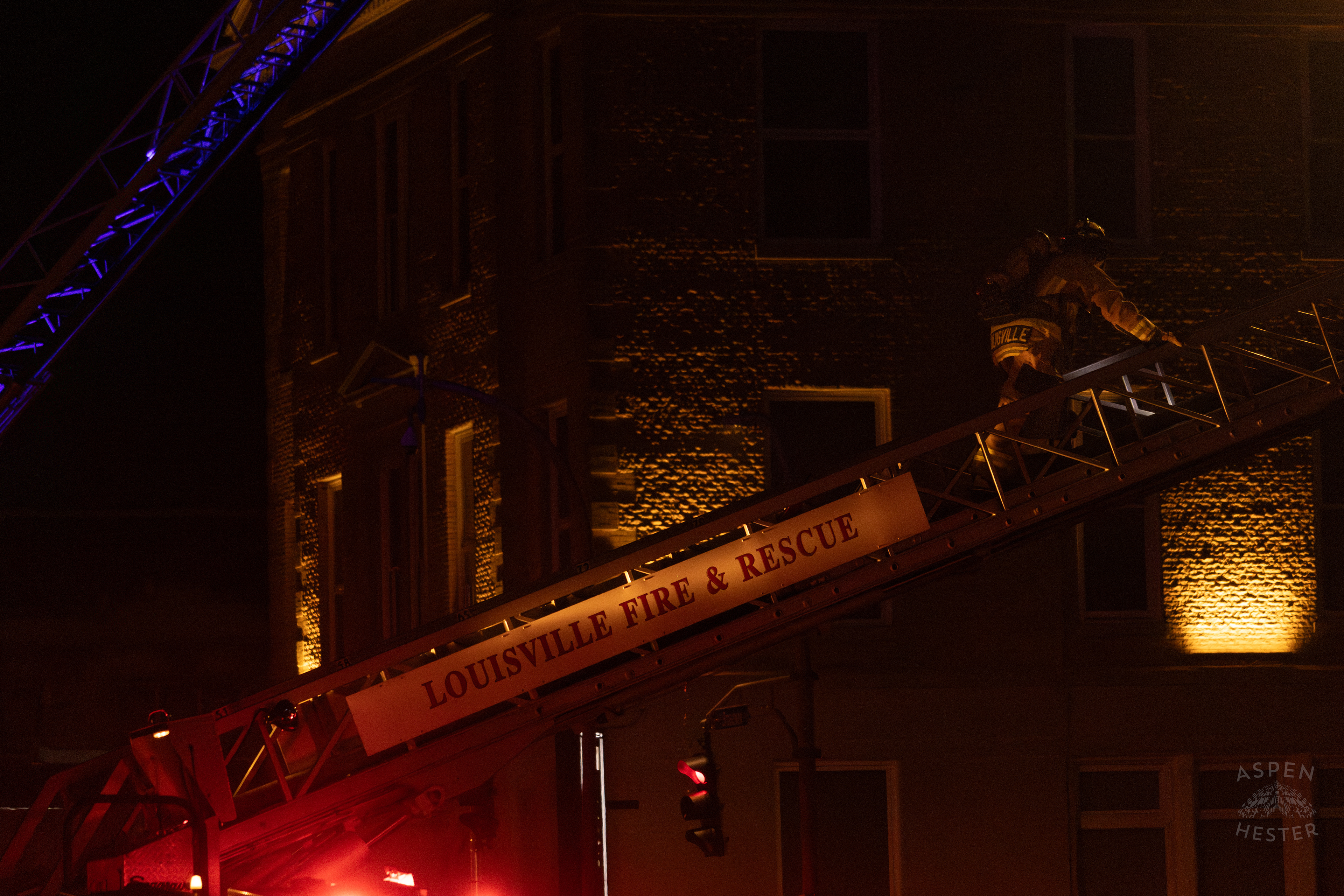 Firefighter Climbing an Aerial to Battle the Massive 3 Alarm Blaze Engulfing The Vacant St. Paul's German Evangelical Church on East Broadway. October 9th, 2024/Aspen Hester