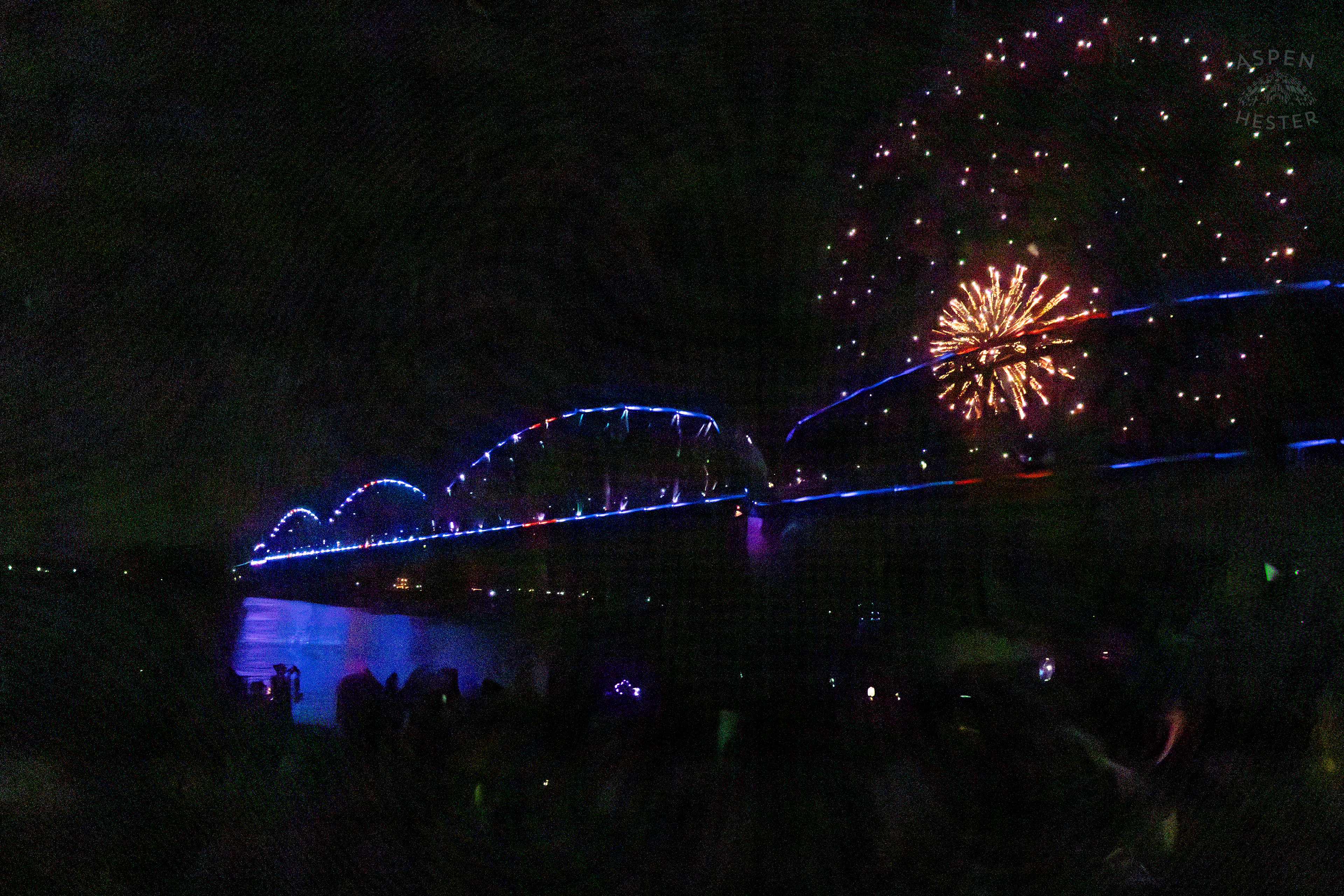 The Big Four Bridge and Attendees During The Fireworks Show at Waterfront Park Fourth of July. July 4th, 2024/Aspen Hester