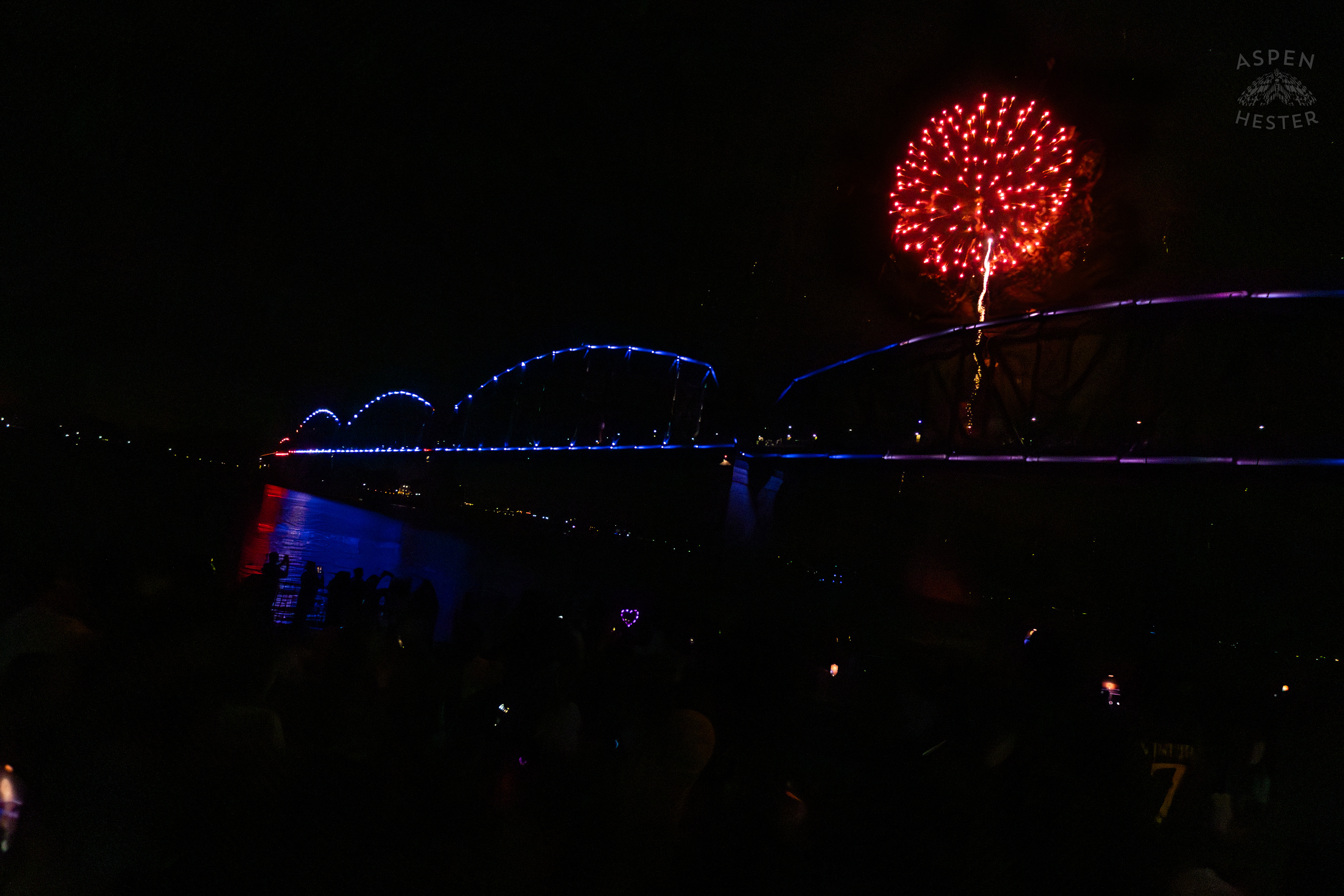 The Big Four Bridge and Attendees During The Fireworks Show at Waterfront Park Fourth of July. July 4th, 2024/Aspen Hester