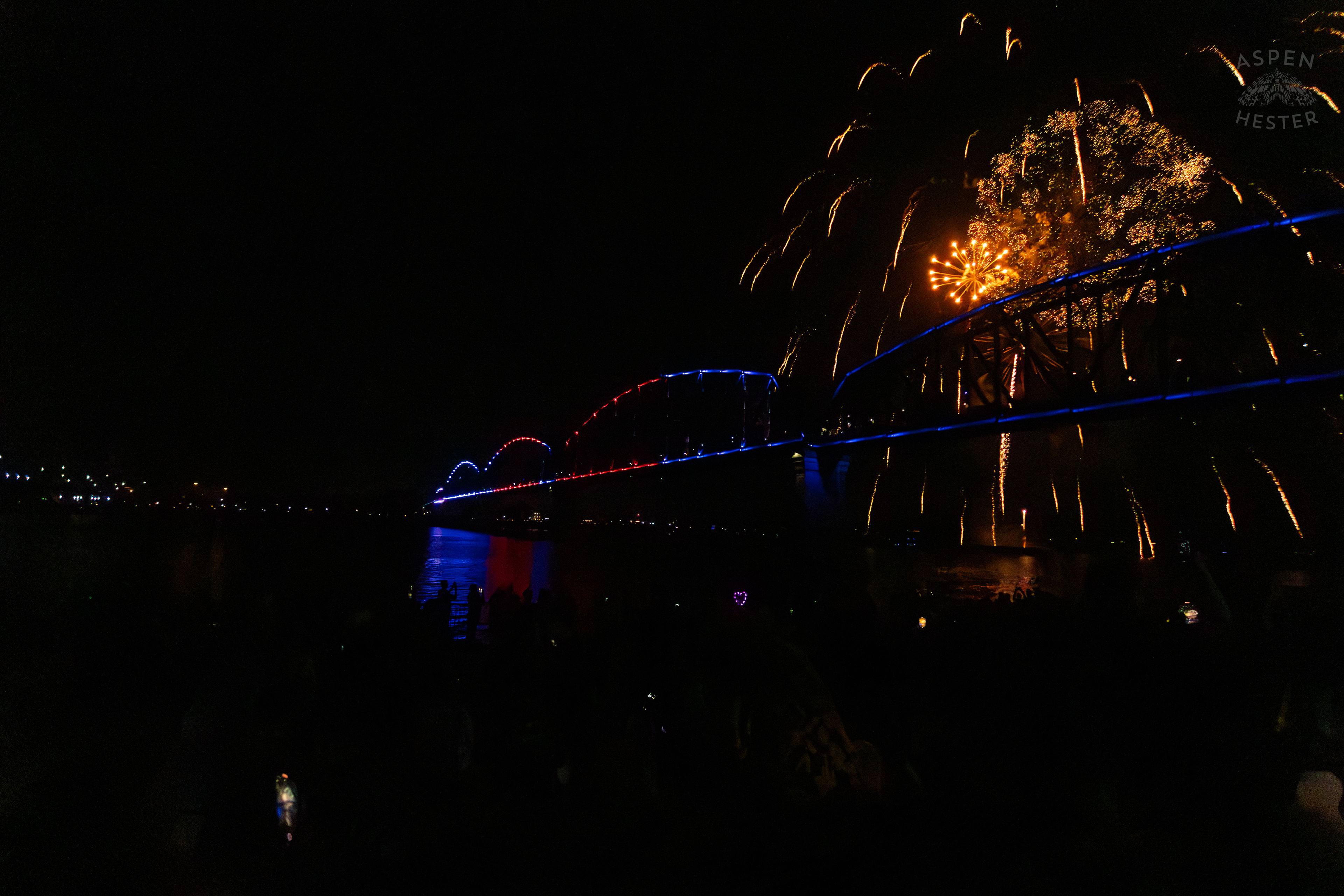 The Big Four Bridge and Attendees During The Fireworks Show at Waterfront Park Fourth of July. July 4th, 2024/Aspen Hester