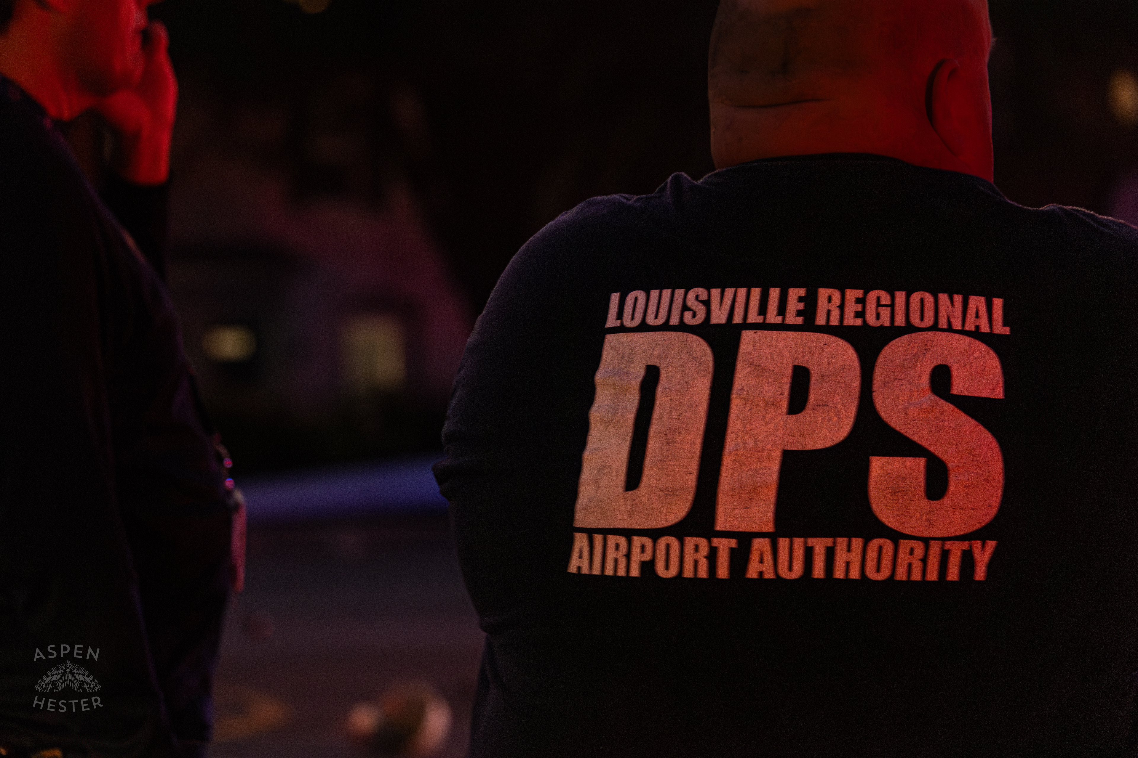 Airport Authorities Watching Over The Scene Where A Piper Cherokee Plane Crash Landed, Taking Out Utility Poles, and Hitting A Car on Breckenridge Lane and Kresge Way. October 11th, 2024/Aspen Hester 