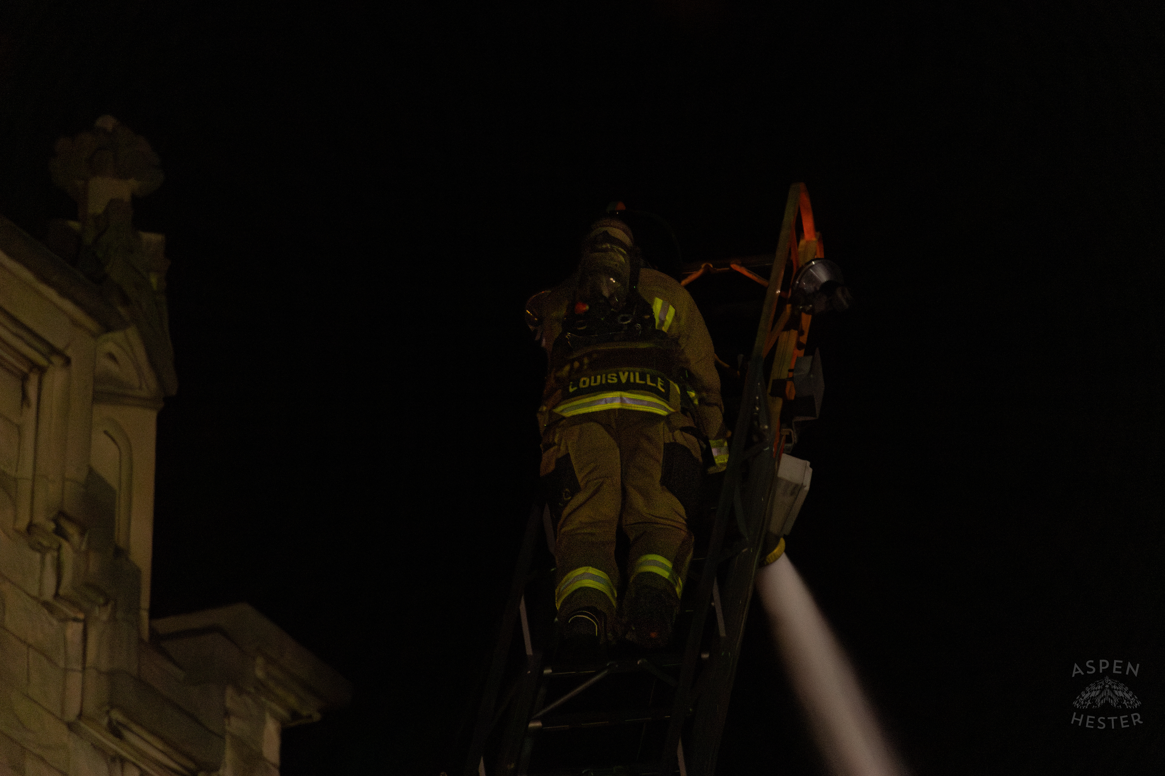 Firefighter Climbing an Aerial to Battle the Massive 3 Alarm Blaze Engulfing The Vacant St. Paul's German Evangelical Church on East Broadway. October 9th, 2024/Aspen Heste