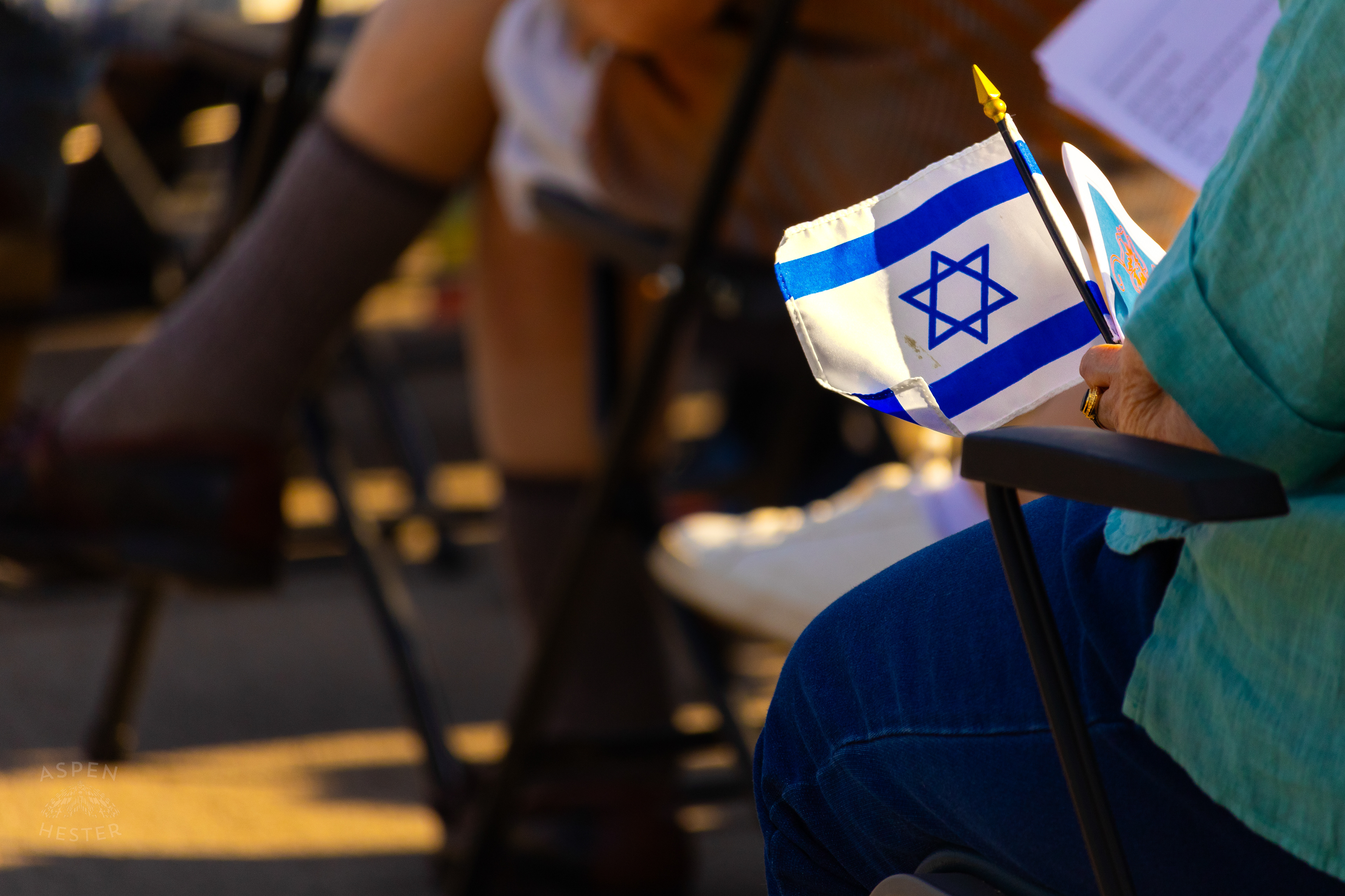 Someone Holds a Jewish Flag in The Crowd Gathered at The Trager Jewish Community Center to Remember The Victims and Pray for Peace One Year After The October 7th 2023 Hamas Attack. October 6th, 2024/Aspen Hester