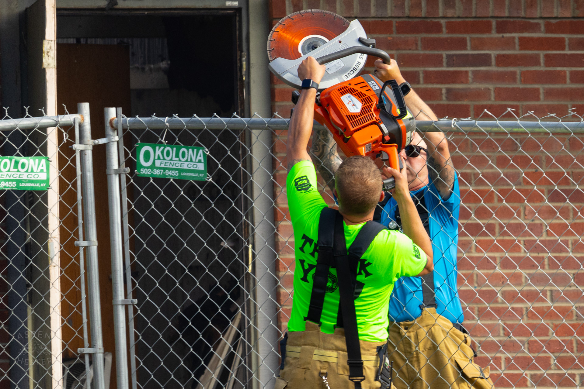 Firefighters Passing Tools at The Old Library on Preston Highway. May 31st, 2024/Aspen Hester