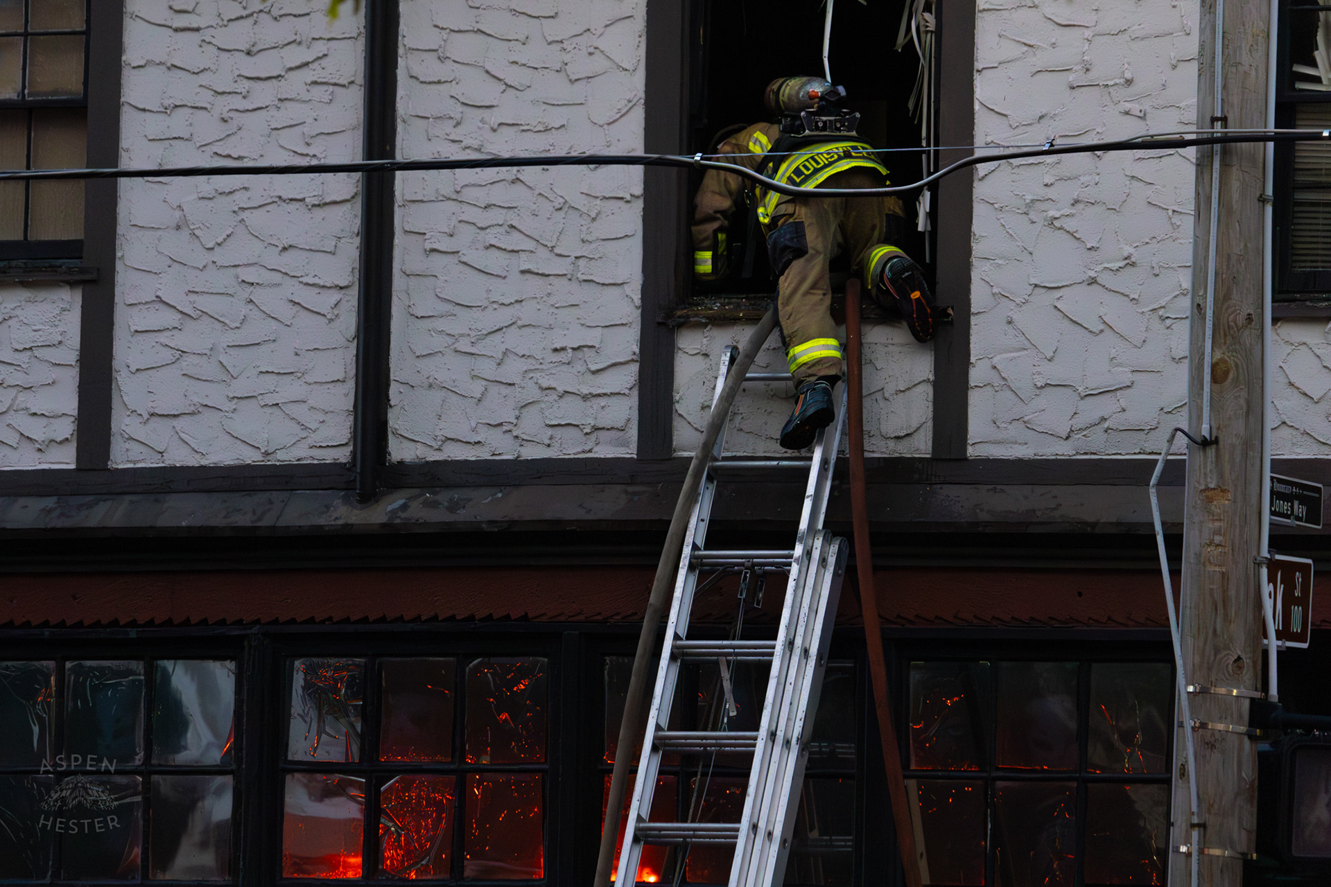 Louisville Firefighter Entering Burning Building on The Corner of 2nd and Oak Street. June 7th, 2024/Aspen Hester