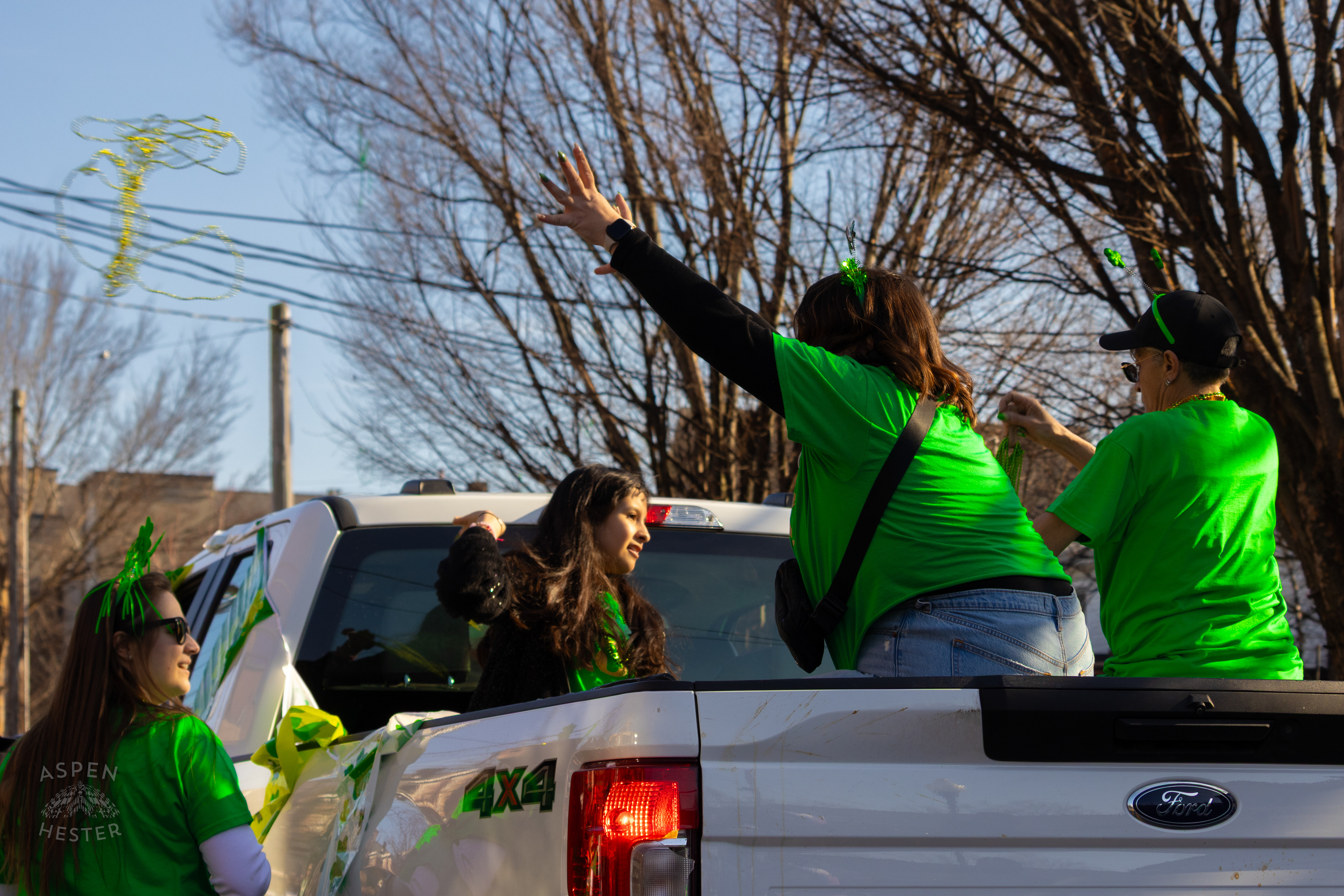 Participants with Churchill Downs Toss Beads to Spectators as The 52nd Annual Saint Patrick’s Day Parade Rolls Through The Highlands. March 8th, 2025/Aspen Hester