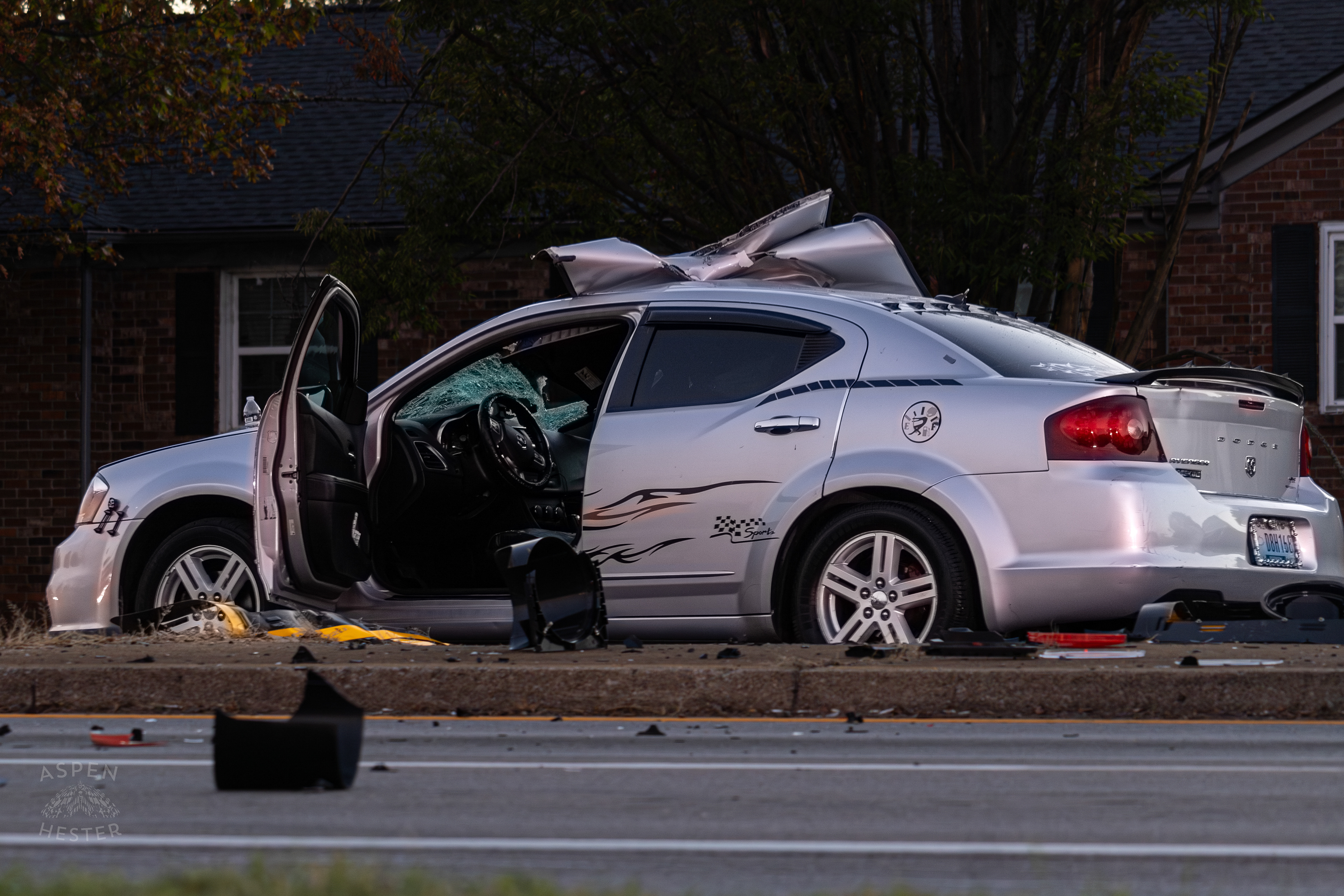 The Mangled Dodge Charger after A Piper Cherokee Plane Crash Landed, Taking Out Utility Poles, and Hitting This Car on Breckenridge Lane and Kresge Way. October 11th, 2024/Aspen Hester 