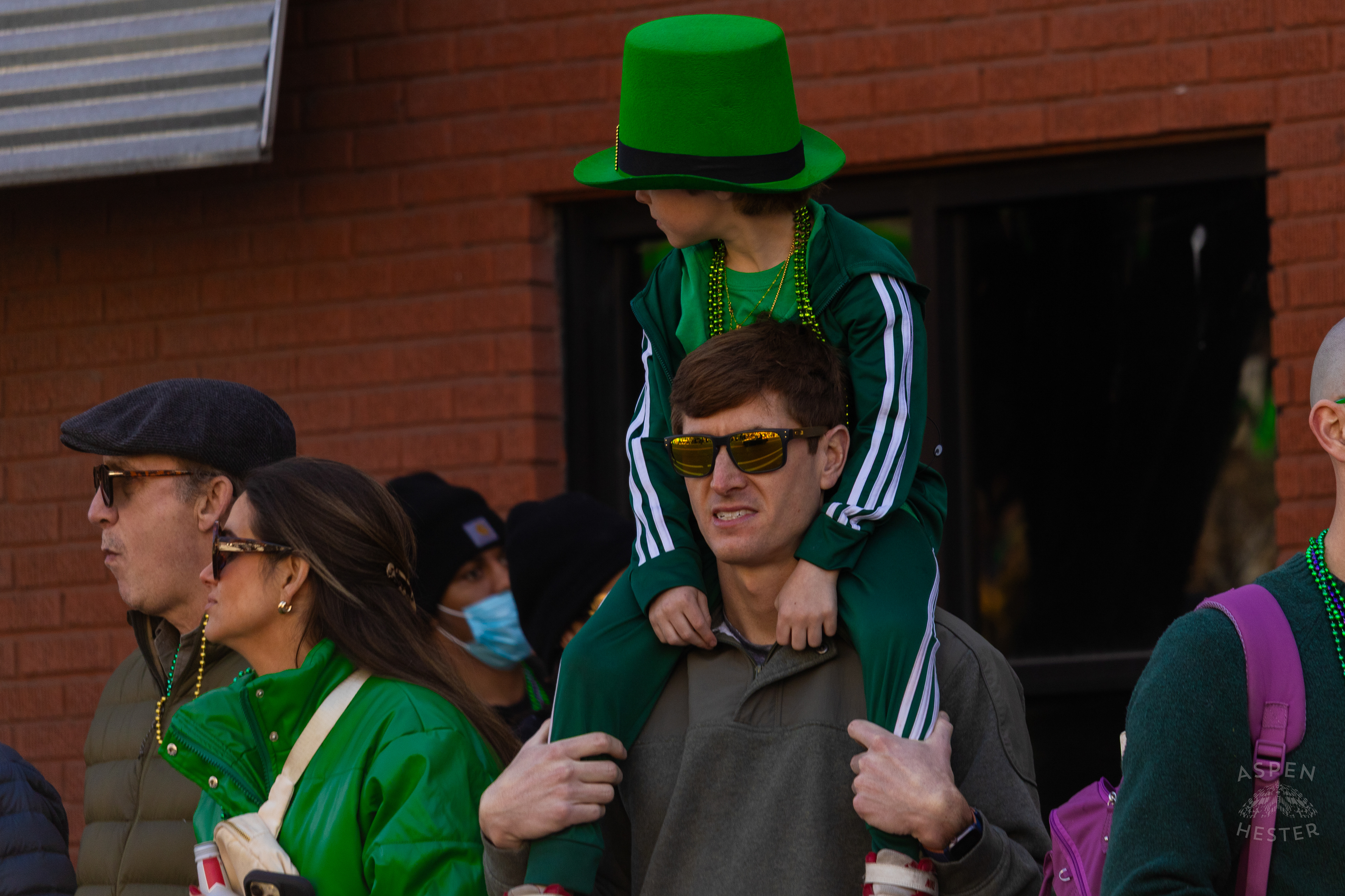 A Father and Son Enjoy The Festivities as The 52nd Annual Saint Patrick’s Day Parade Rolls Through The Highlands. March 8th, 2025/Aspen Hester