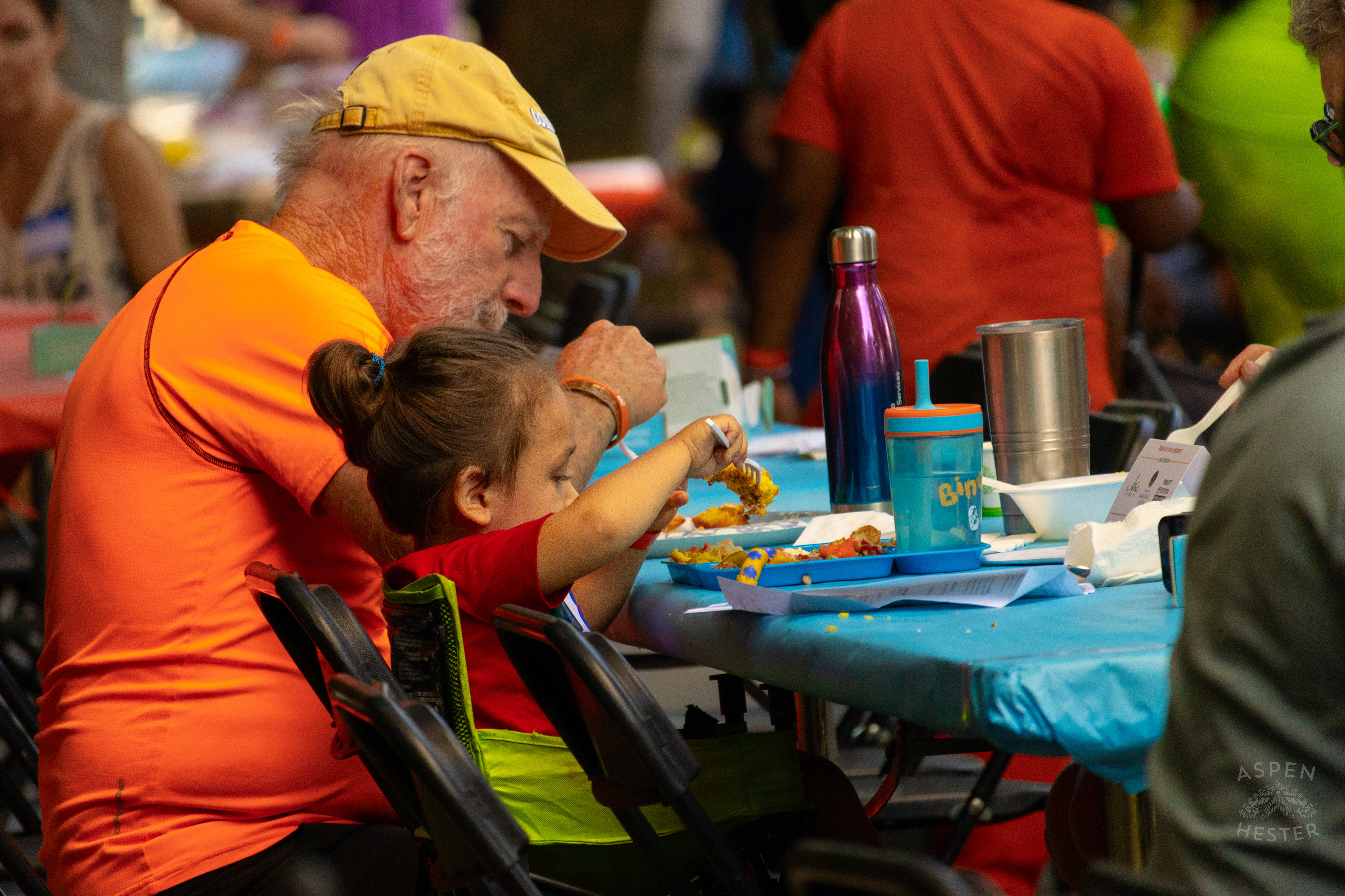 A Young Child Feeds Themself from The Big Table at Iroquois Park. September 15th, 2024/Aspen Hester