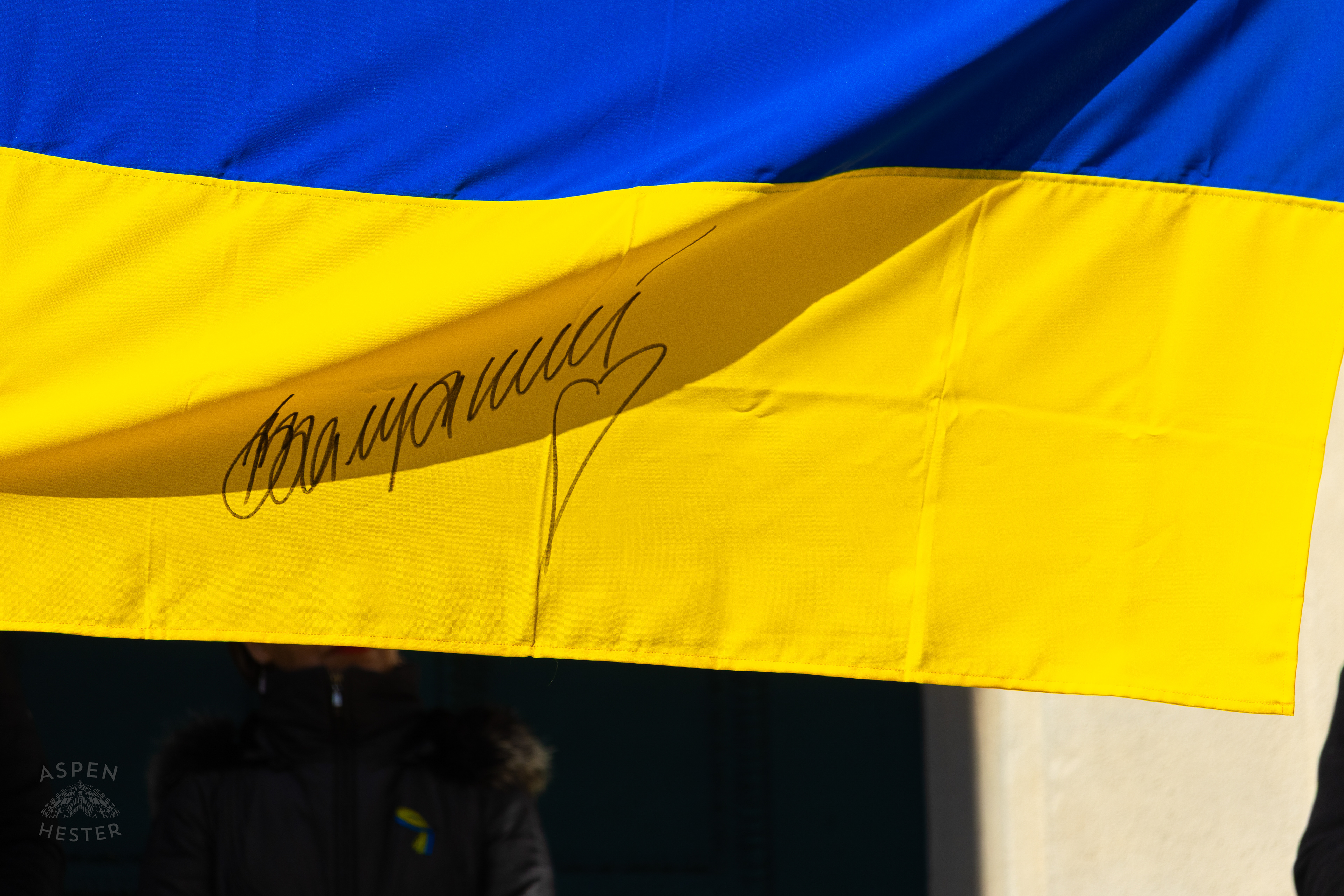 Ukrainian Louisvillians Hold A Ukraine Flag Signed by an Army Hero as The Community Rallies in Support of Ukraine. March 2nd, 2025/Aspen Hester