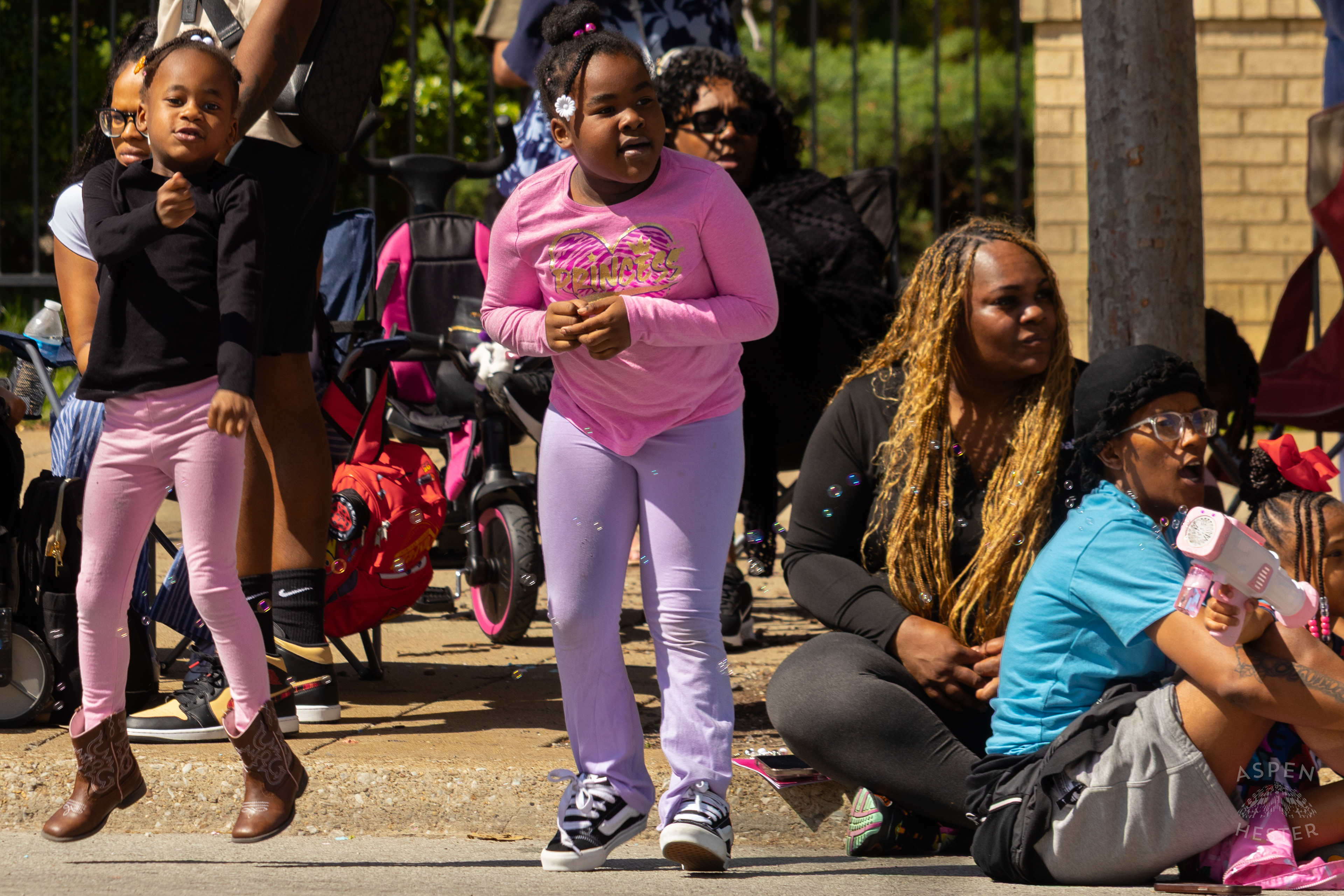 Children Jump and Shout Along West Broadway for The 70th Annual Pegasus Parade. April 27th, 2025/Aspen Hester