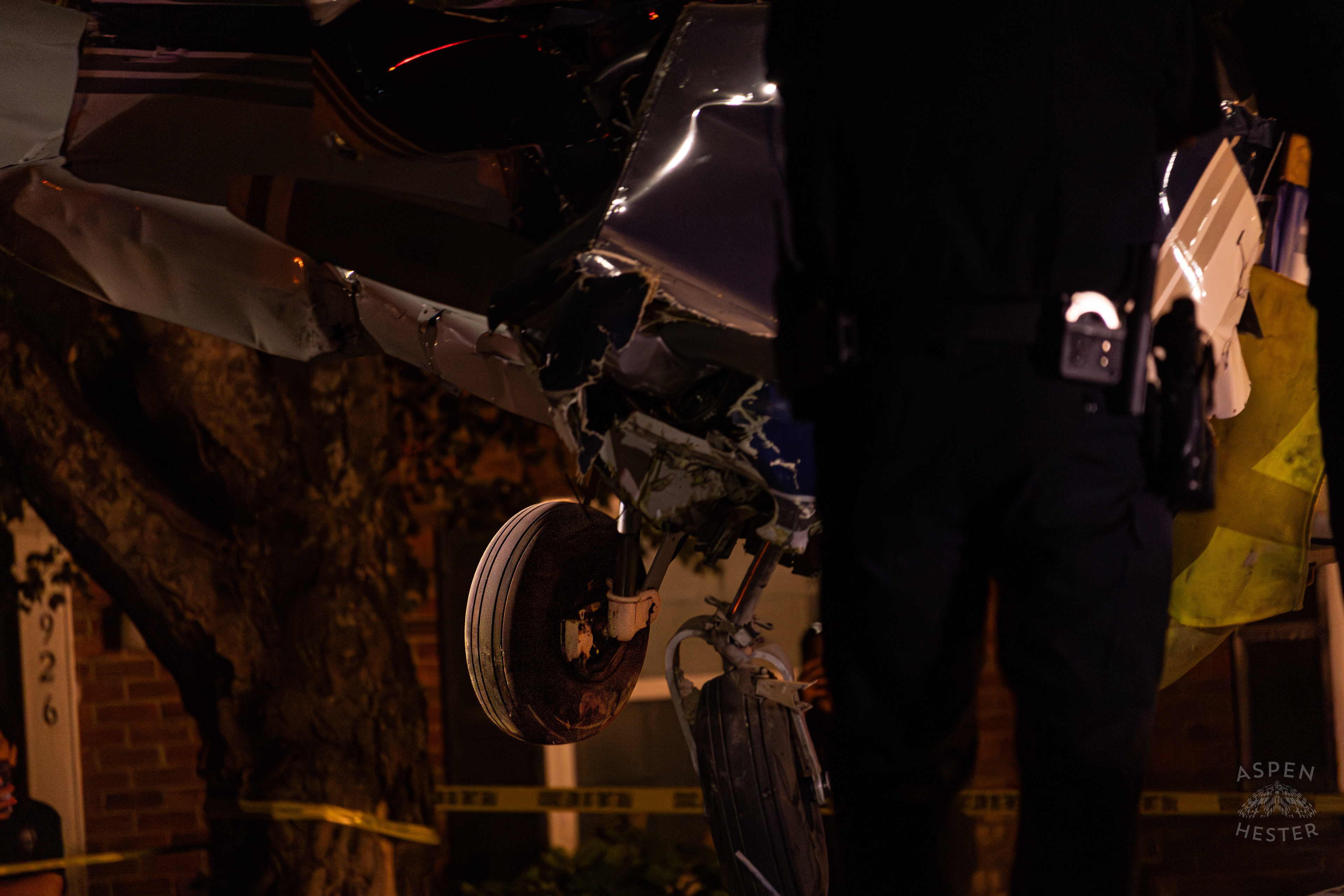 St. Matthews Police Watching as A Tony’s Wreckers Crew Works to Remove The Piper Cherokee Plane from the Road after it Crash Landed, Taking Out Utility Poles, and Hitting A Car on Breckenridge Lane and Kresge Way. October 11th, 2024/Aspen Hester