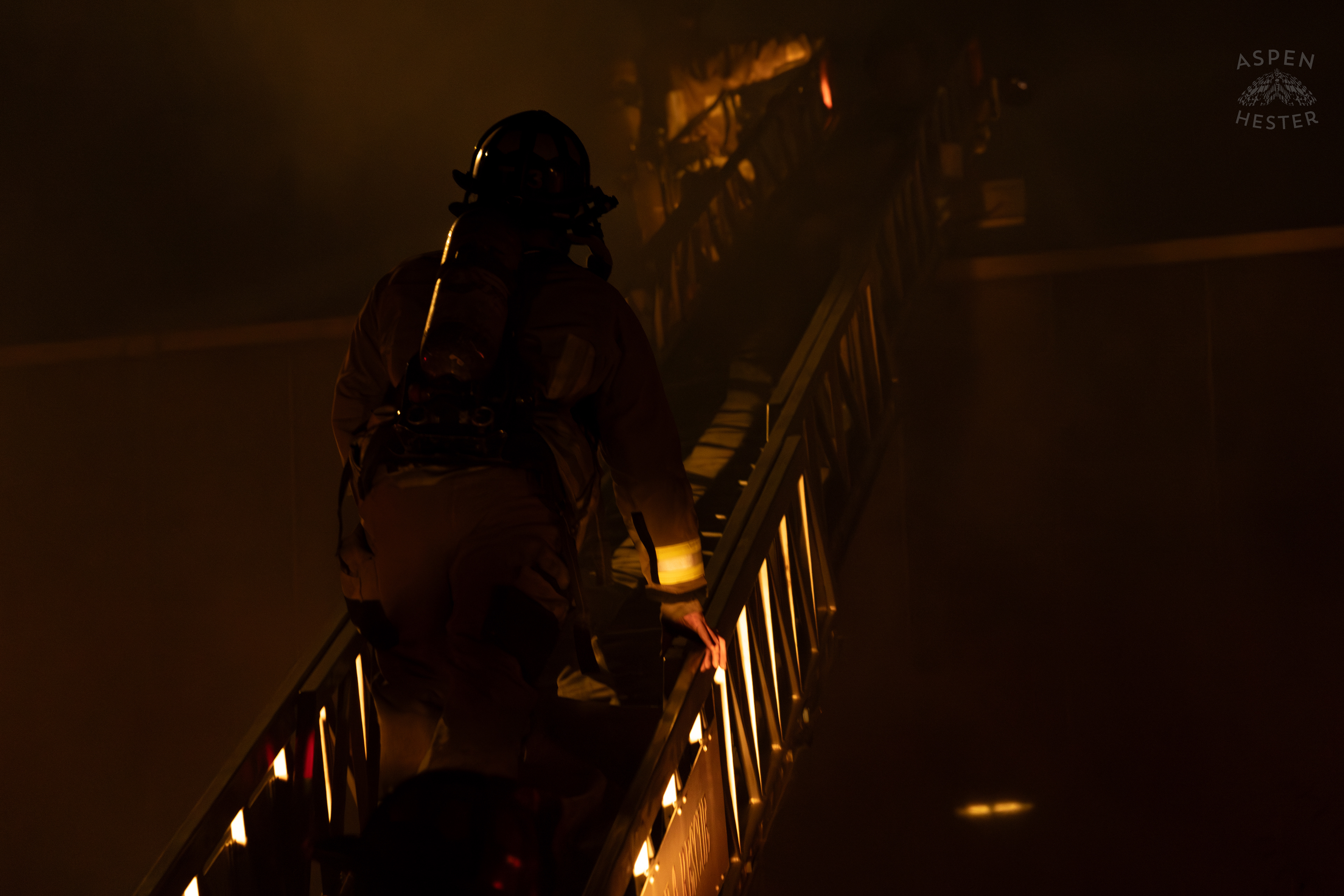 Firefighter Climbing an Aerial to Battle the Massive 3 Alarm Blaze Engulfing The Vacant St. Paul's German Evangelical Church on East Broadway. October 9th, 2024/Aspen Hester