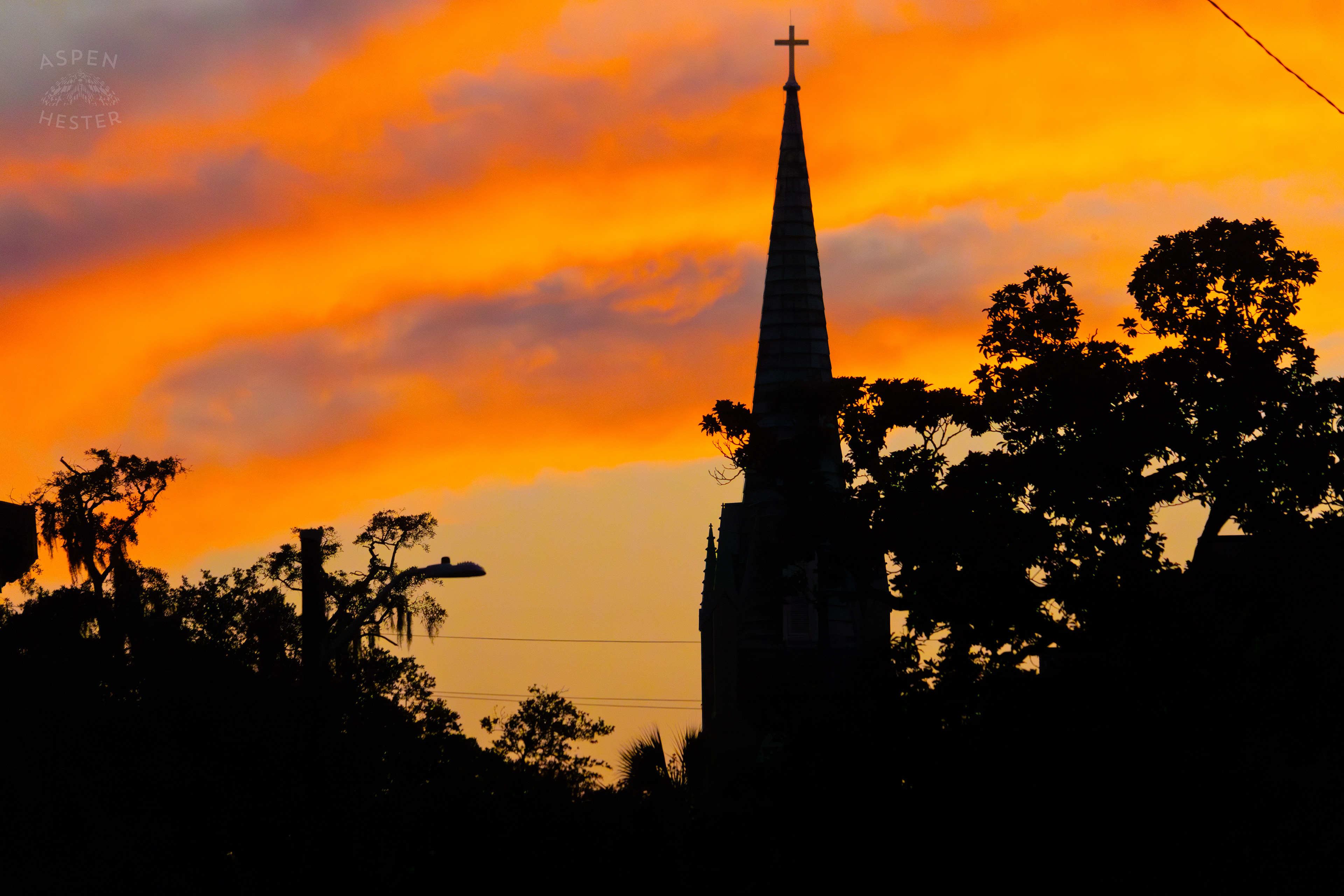 Steeple Against The Fiery Sunset In Savannah Georgia. June 24th, 2024/Aspen Hester