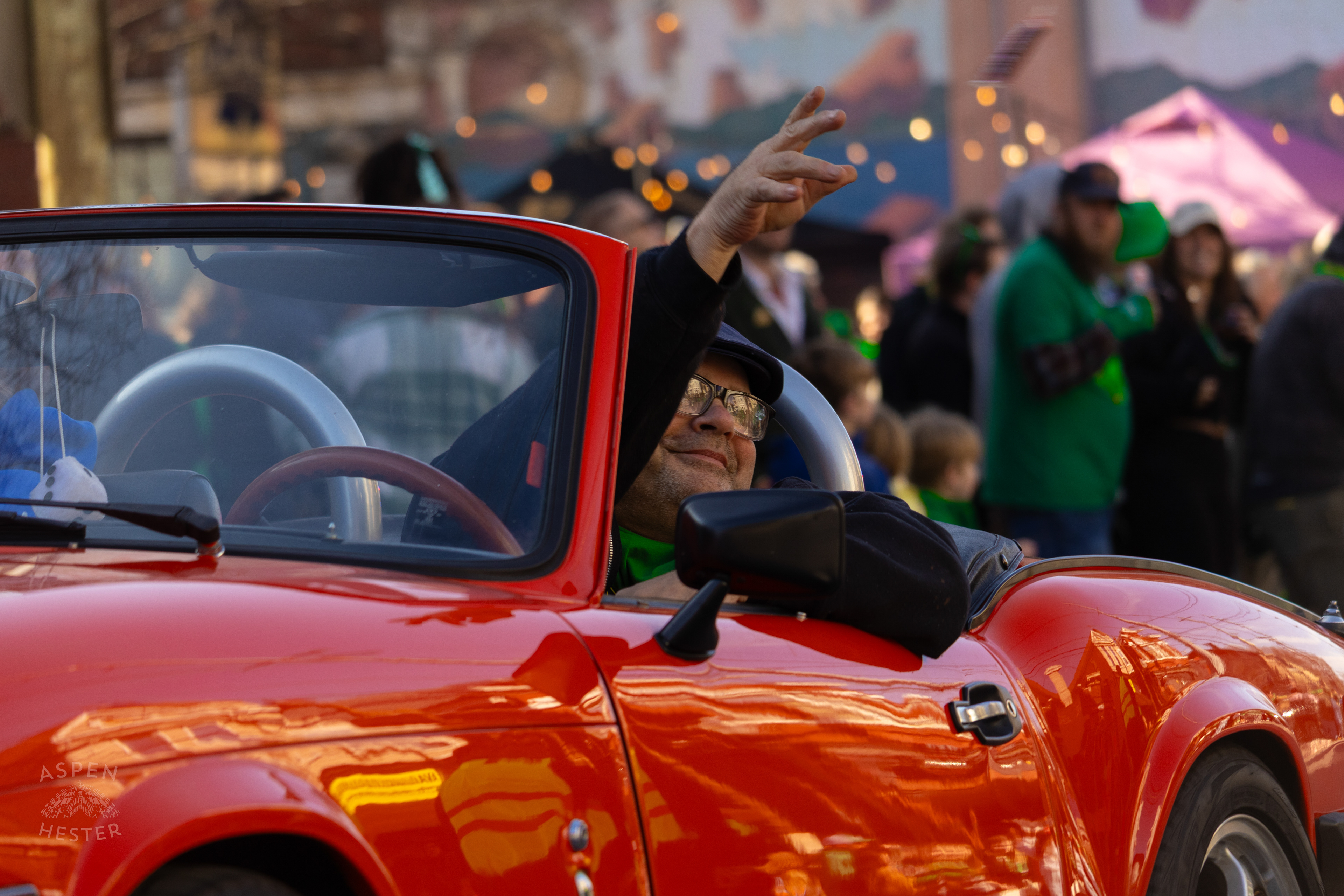 Drivers Throw Beads and Candy From Vintage Cars as The 52nd Annual Saint Patrick’s Day Parade Rolls Through The Highlands. March 8th, 2025/Aspen Hester