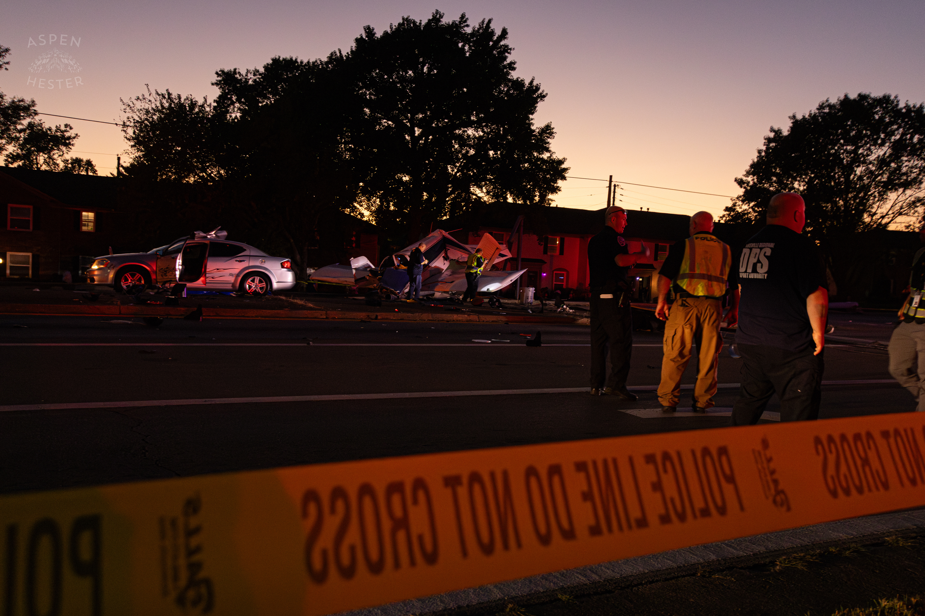 Police Investigating The Scene Where A Piper Cherokee Plane Crash Landed, Taking Out Utility Poles, and Hitting A Car on Breckenridge Lane and Kresge Way. October 11th, 2024/Aspen Hester 