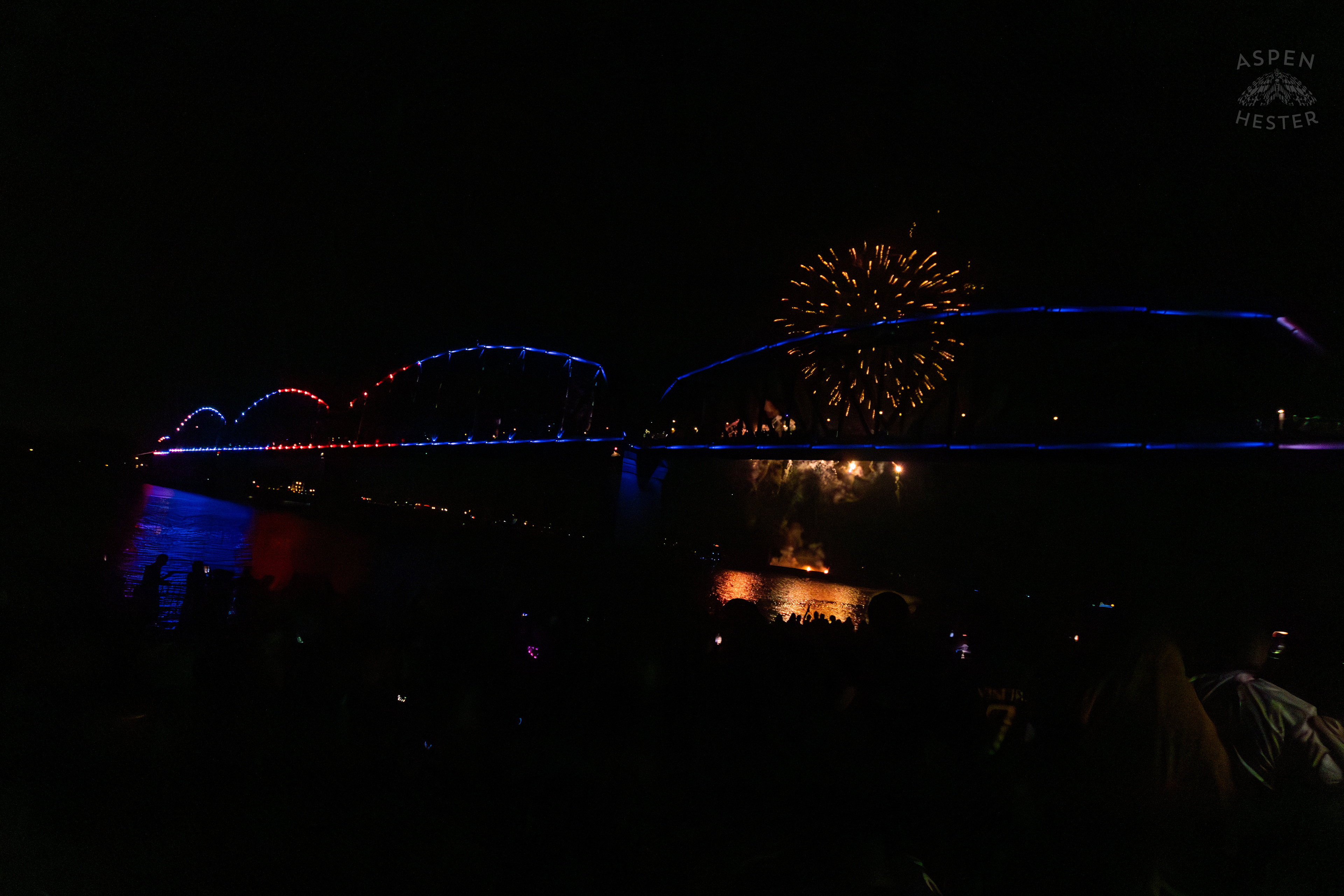 The Big Four Bridge and Attendees During The Fireworks Show at Waterfront Park Fourth of July. July 4th, 2024/Aspen Hester