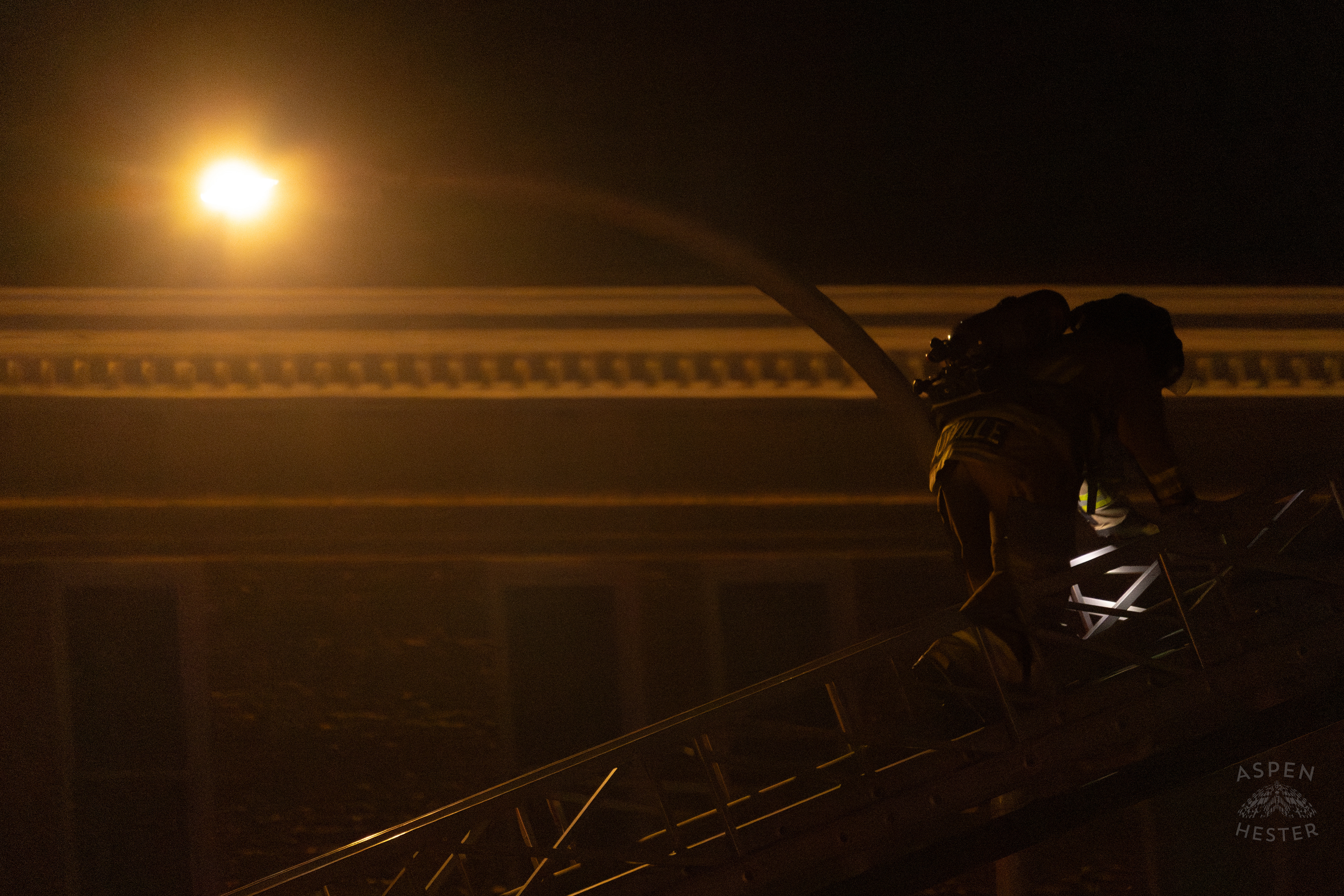 Firefighter Climbing an Aerial to Battle the Massive 3 Alarm Blaze Engulfing The Vacant St. Paul's German Evangelical Church on East Broadway. October 9th, 2024/Aspen Hester