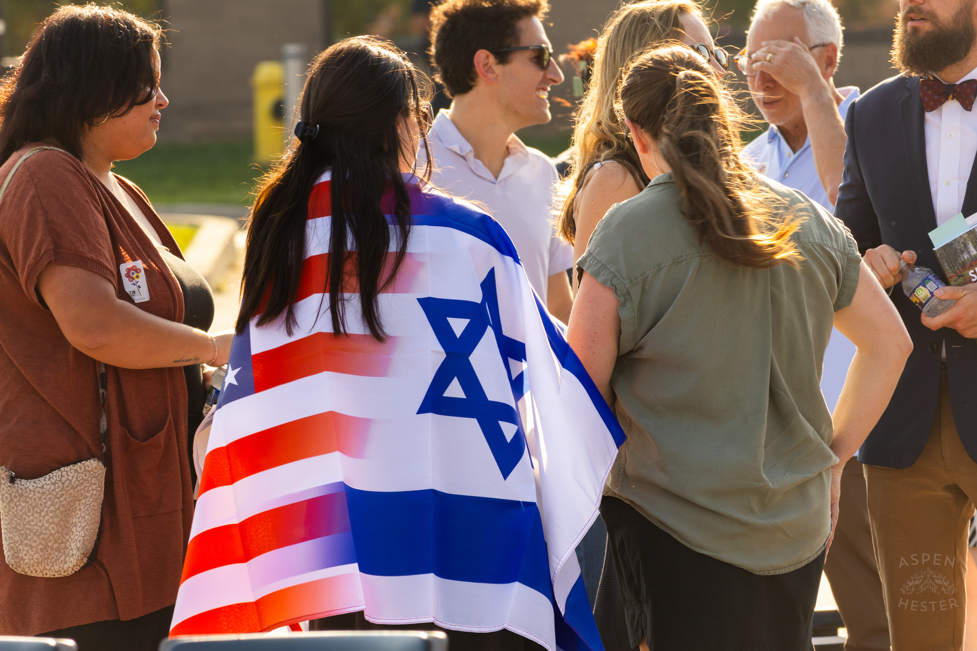 Crowd Member Wearing A Jewish and American Flag at The Trager Jewish Community Centers Gathering to Remember The Victims and Pray for Peace One Year After The October 7th 2023 Hamas Attack. October 6th, 2024/Aspen Hester