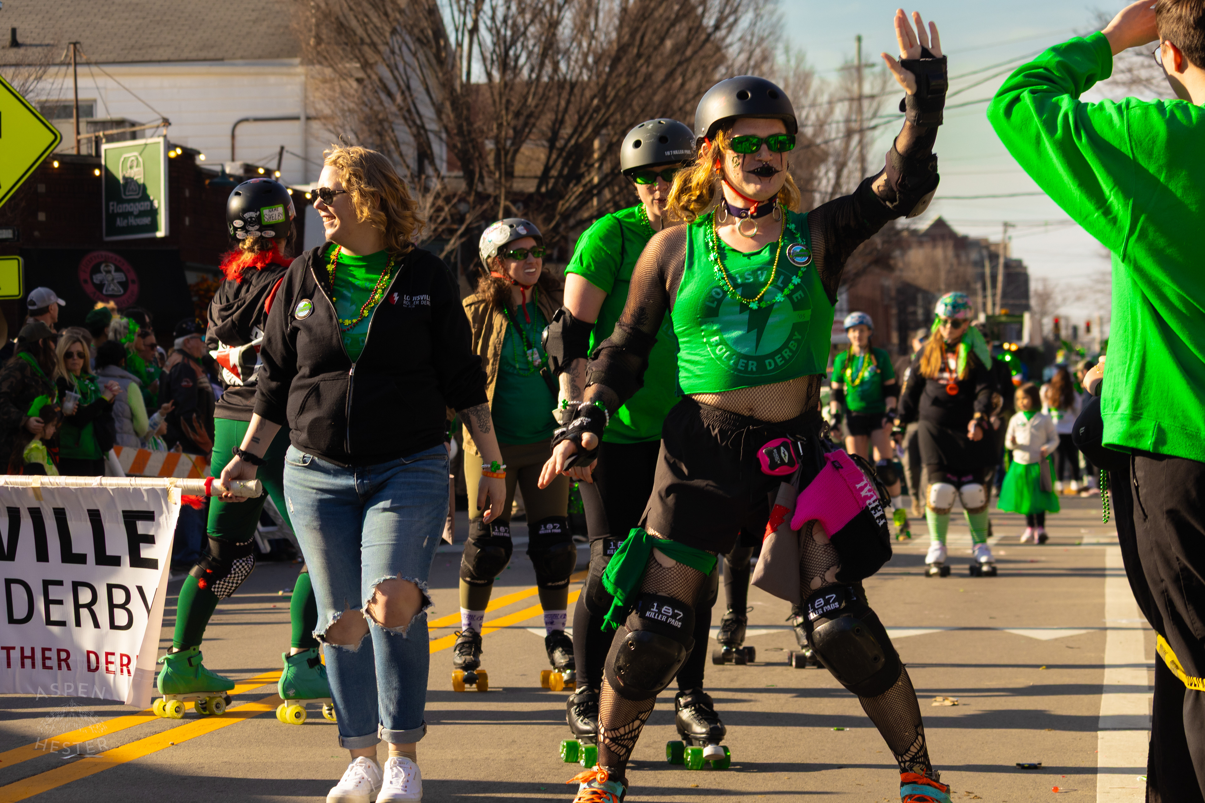 Members of Louisville Roller Derby Skate Through The Highlands in The 52nd Annual Saint Patrick’s Day Parade. March 8th, 2025/Aspen Hester