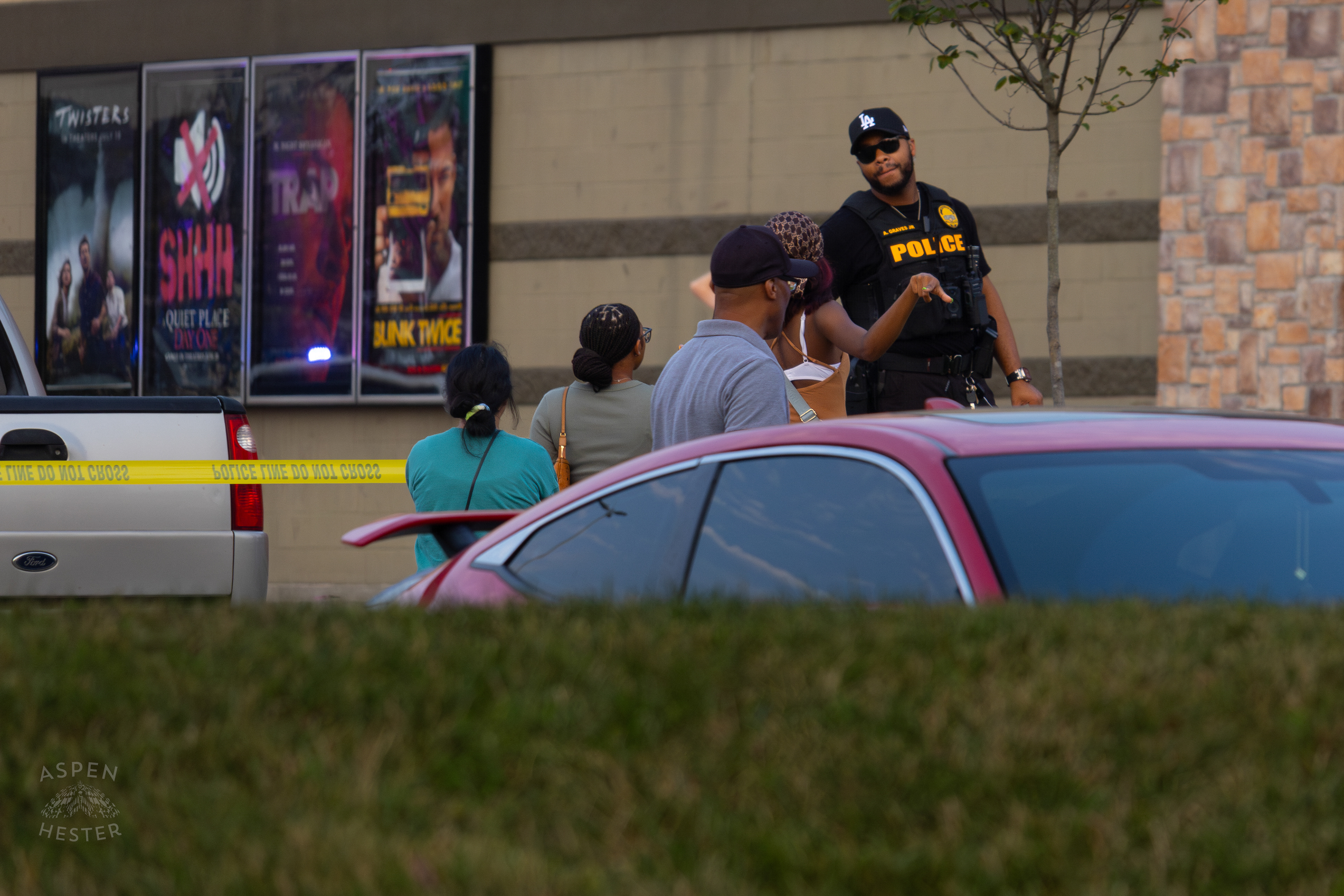 Witnesses Describing What They Saw to A Police Officer At The Scene Where A Man Shot Himself in The Head During A Police Stop Outside Mall St. Matthews. July 27th, 2024/Aspen Hester