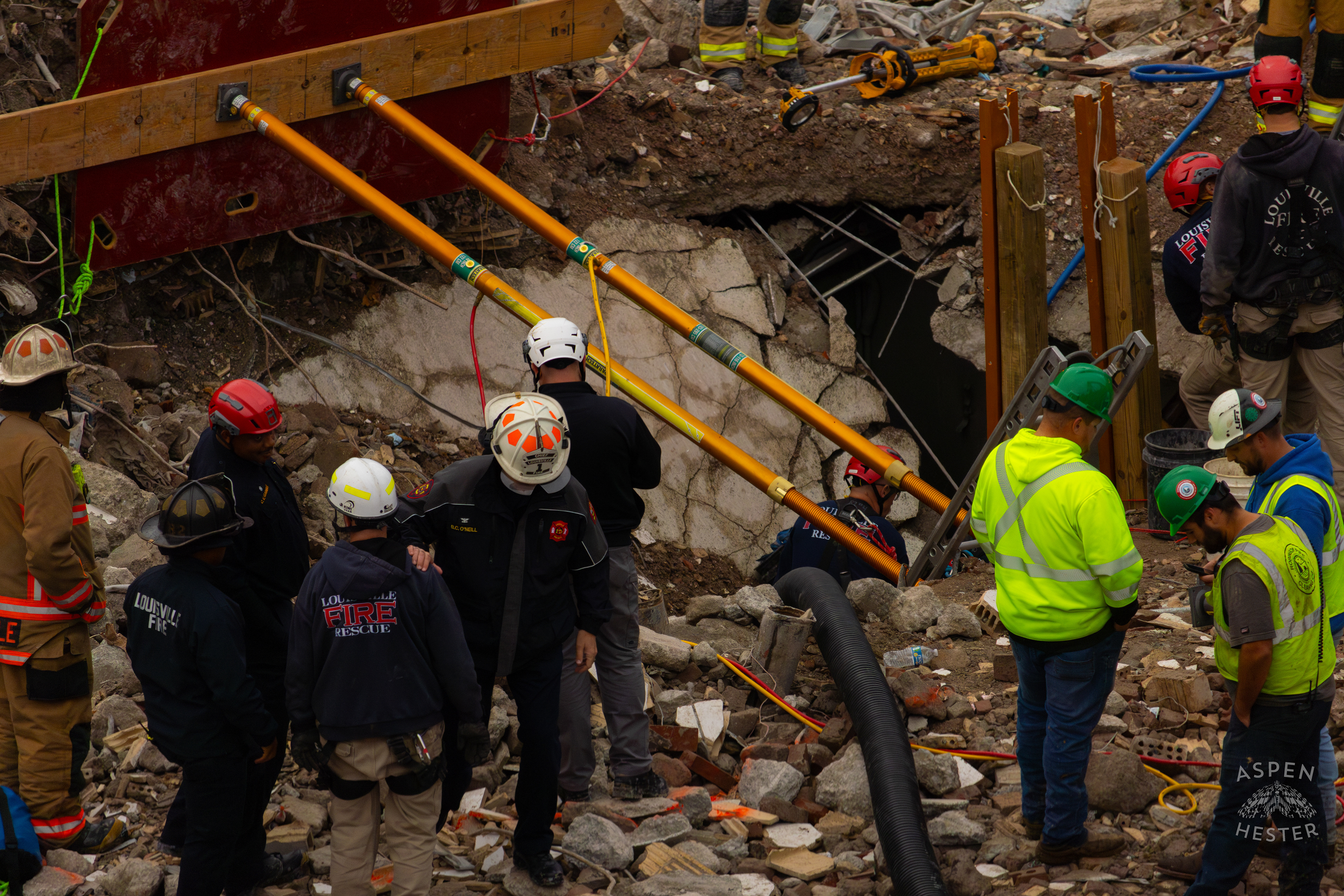 Louisville Fire Chief Bryan O'Neill Puts A Comforting Hand on The Shoulder of A Crew Member As He Passes By During the 8+ Hour LFD Effort to Free A Trapped Demo Worker. November 11th, 2024/Aspen Hester