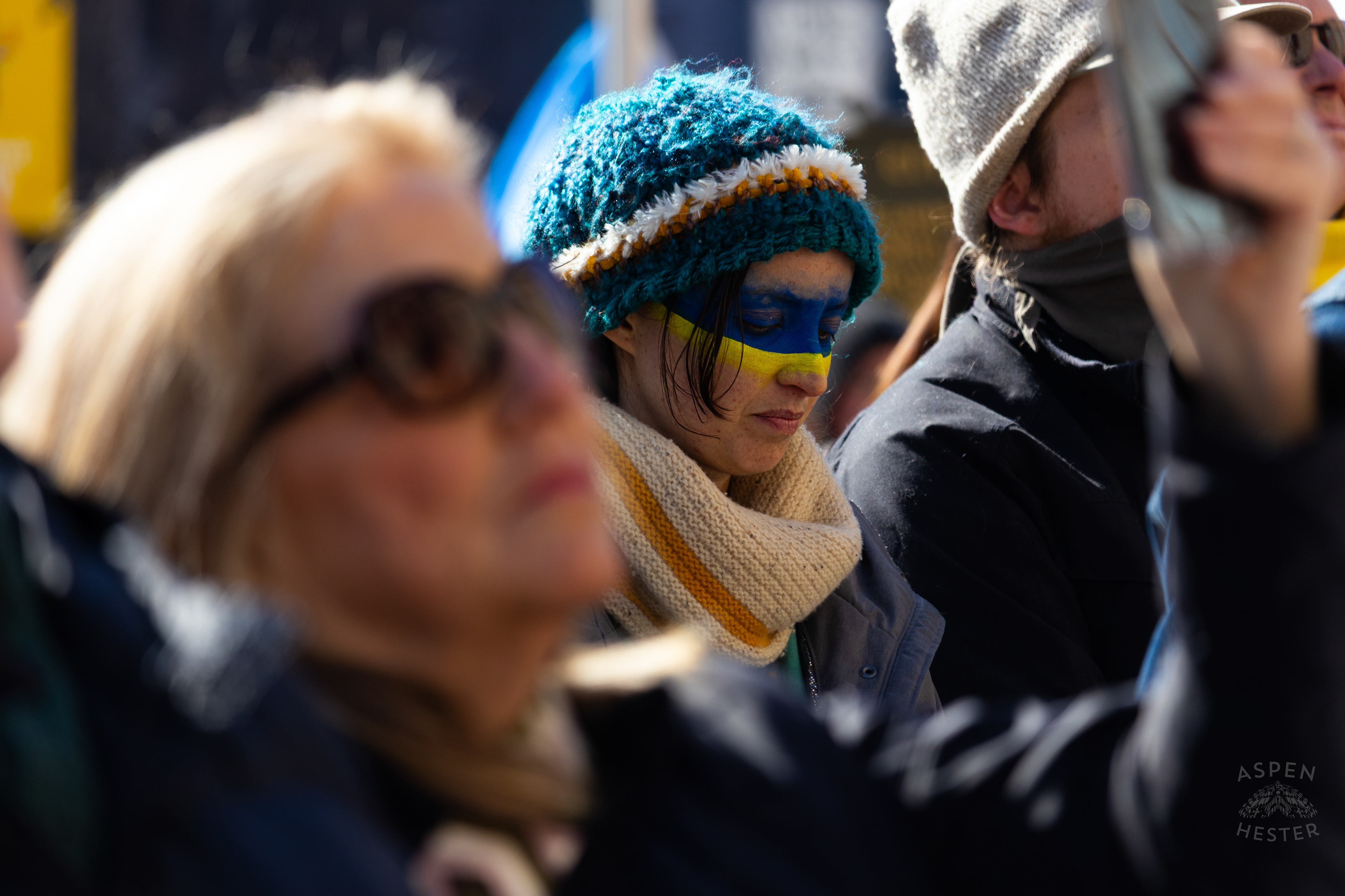 A Louisvillian Wears The Colors of The Ukrainian Flag on Their Face as The Community Rallies in Support of Ukraine. March 2nd, 2025/Aspen Hester