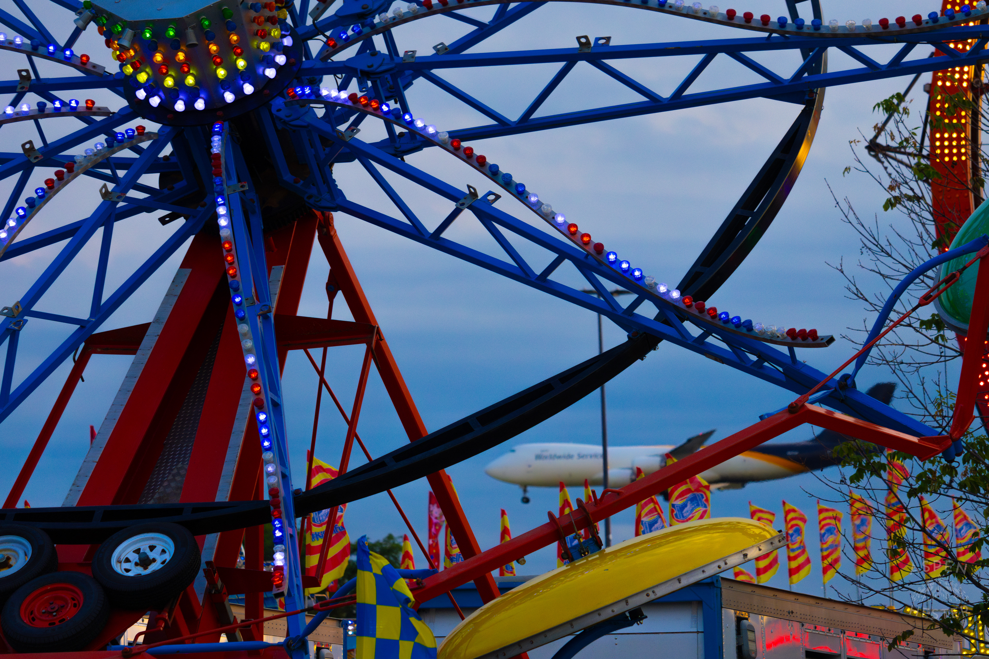 A USPS Plane Lands in the Near Distance Behind The 120th Kentucky State Fair. July 15th, 2024/Aspen Hester