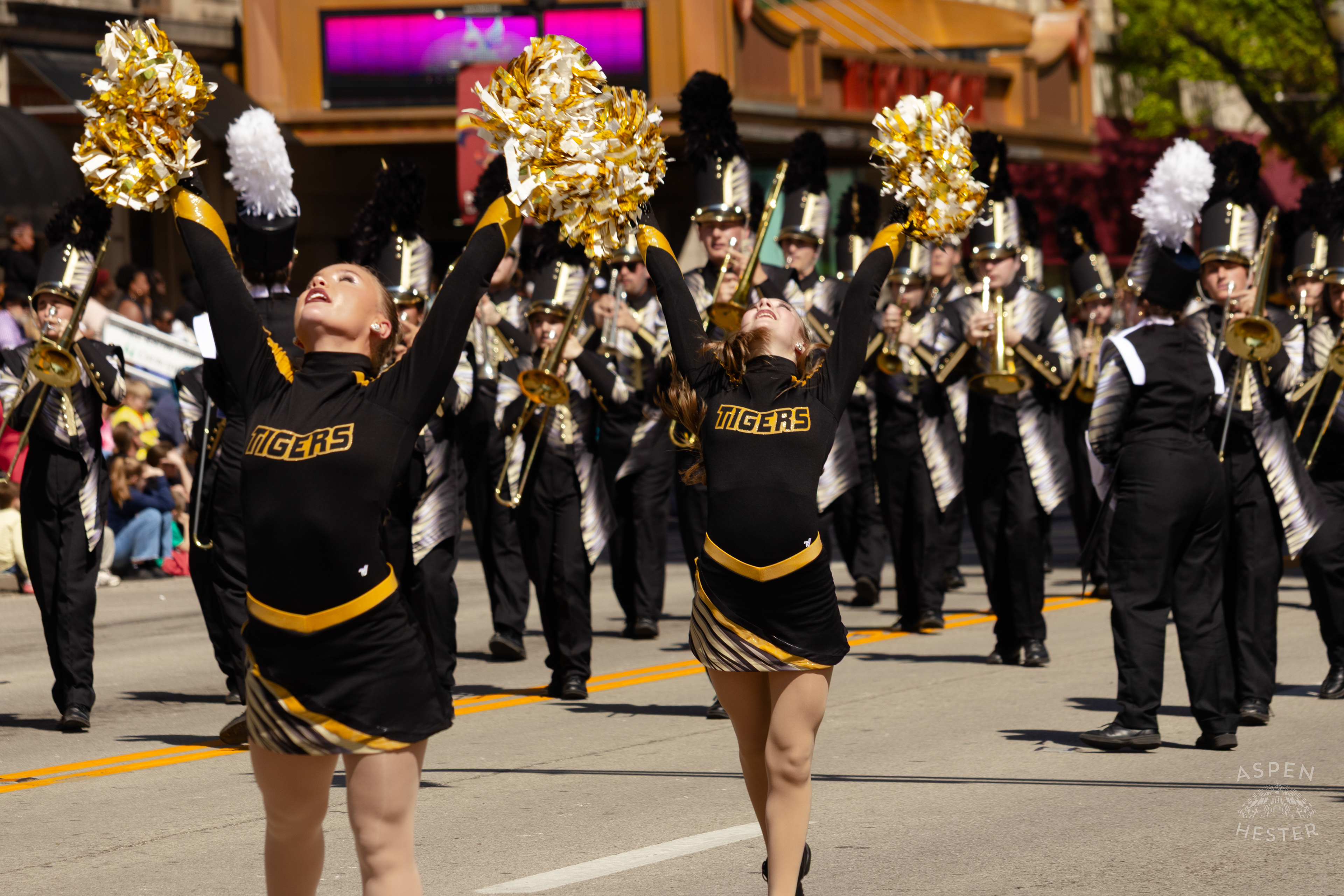Cheerleaders with The North Allegheny Pennsylvania Marching Band Strike A Pose On West Broadway for The 70th Annual Pegasus Parade. April 27th, 2025/Aspen Hester