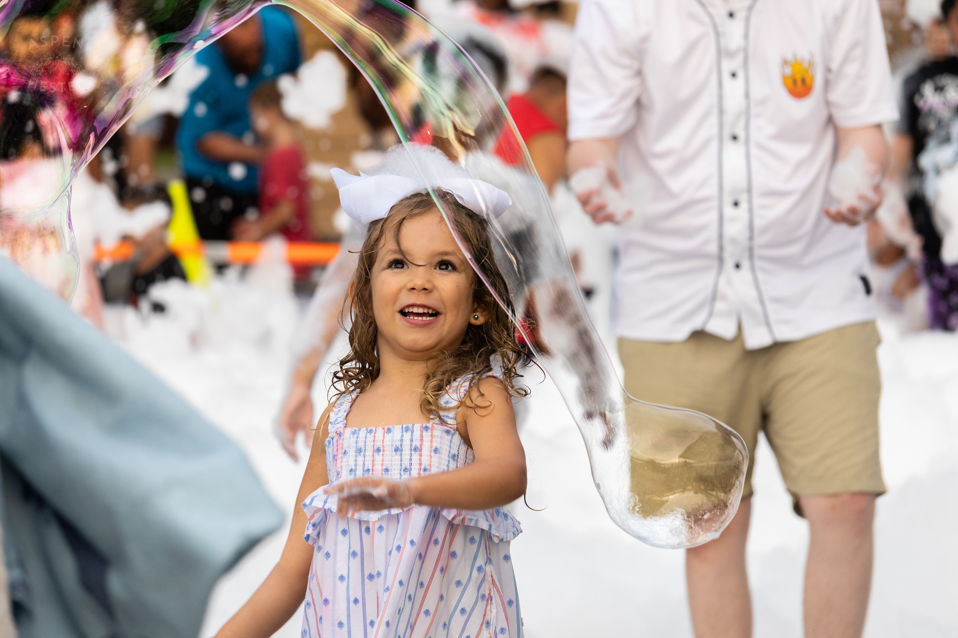 Christina Sanjuan's Daughter Playing in the Bubble Party at Waterfront Park Fourth of July. July 4th, 2024/Aspen Hester