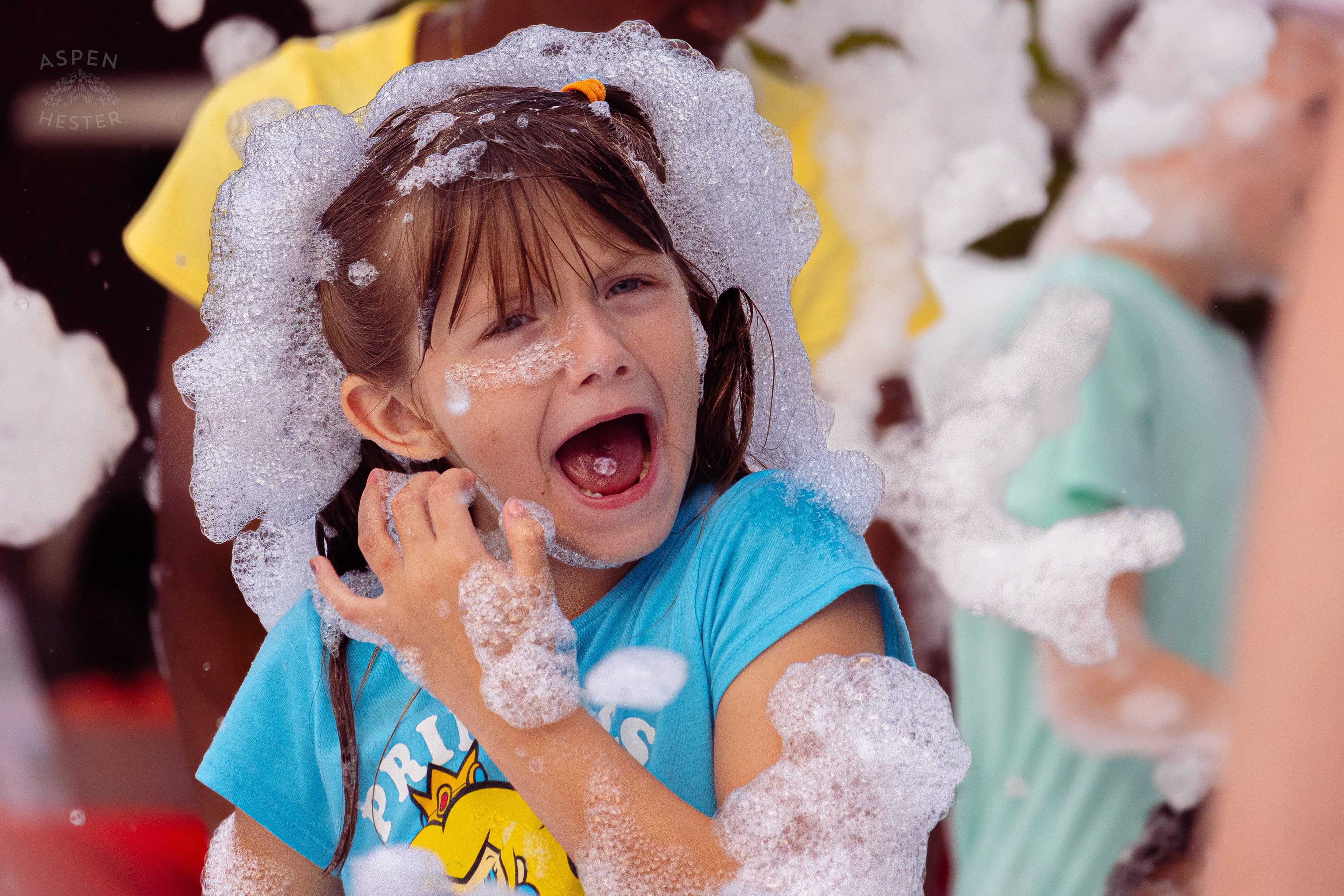 Kid Screams About Soap in Their Eyes at the Bubble Party at Waterfront Park Fourth of July. July 4th, 2024/Aspen Hester