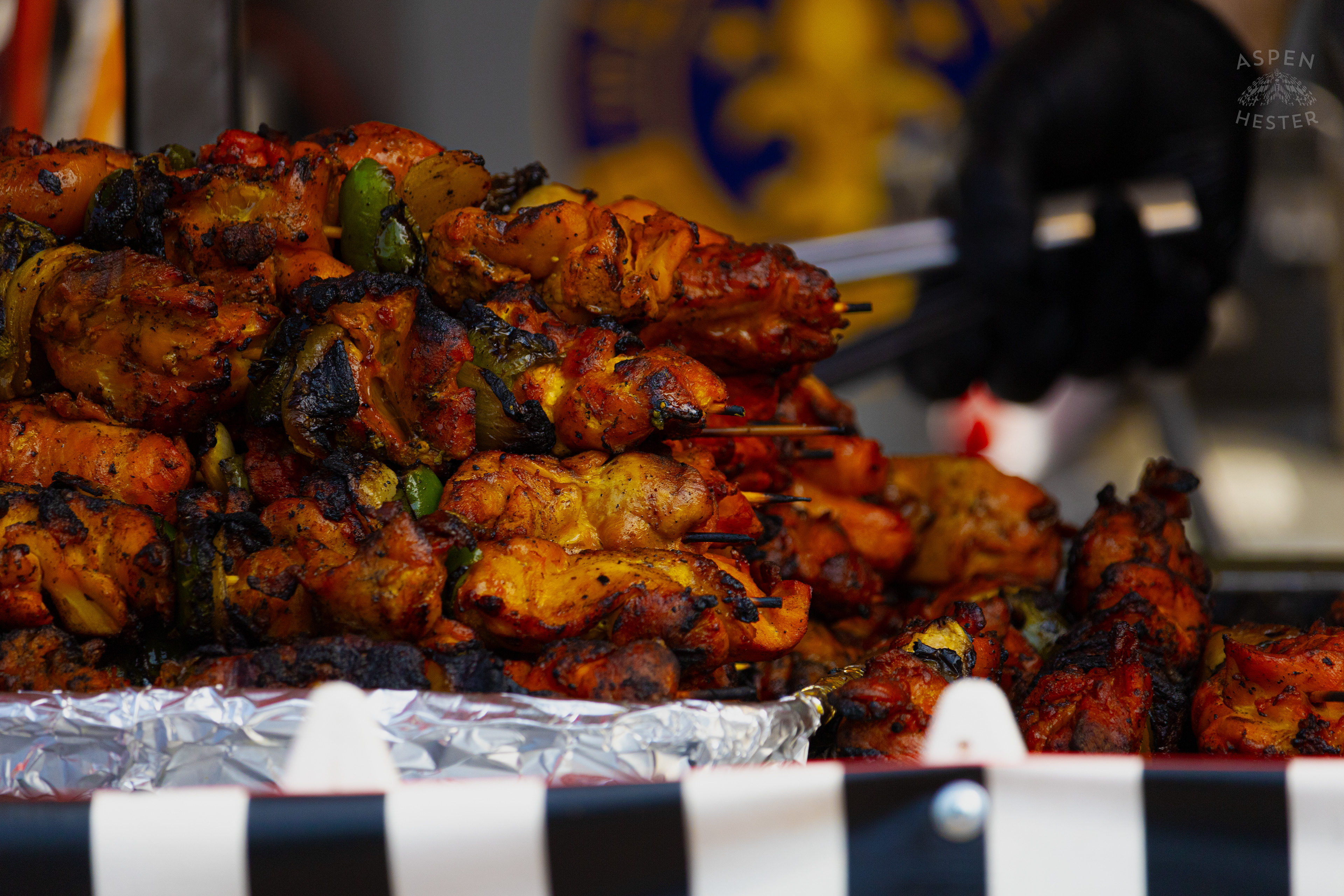 Chef at Enrique's Place Latin Grill Preparing Kabobs for The Opening Day of The 22nd Annual WorldFest. August 30th, 2024. Aspen Hester