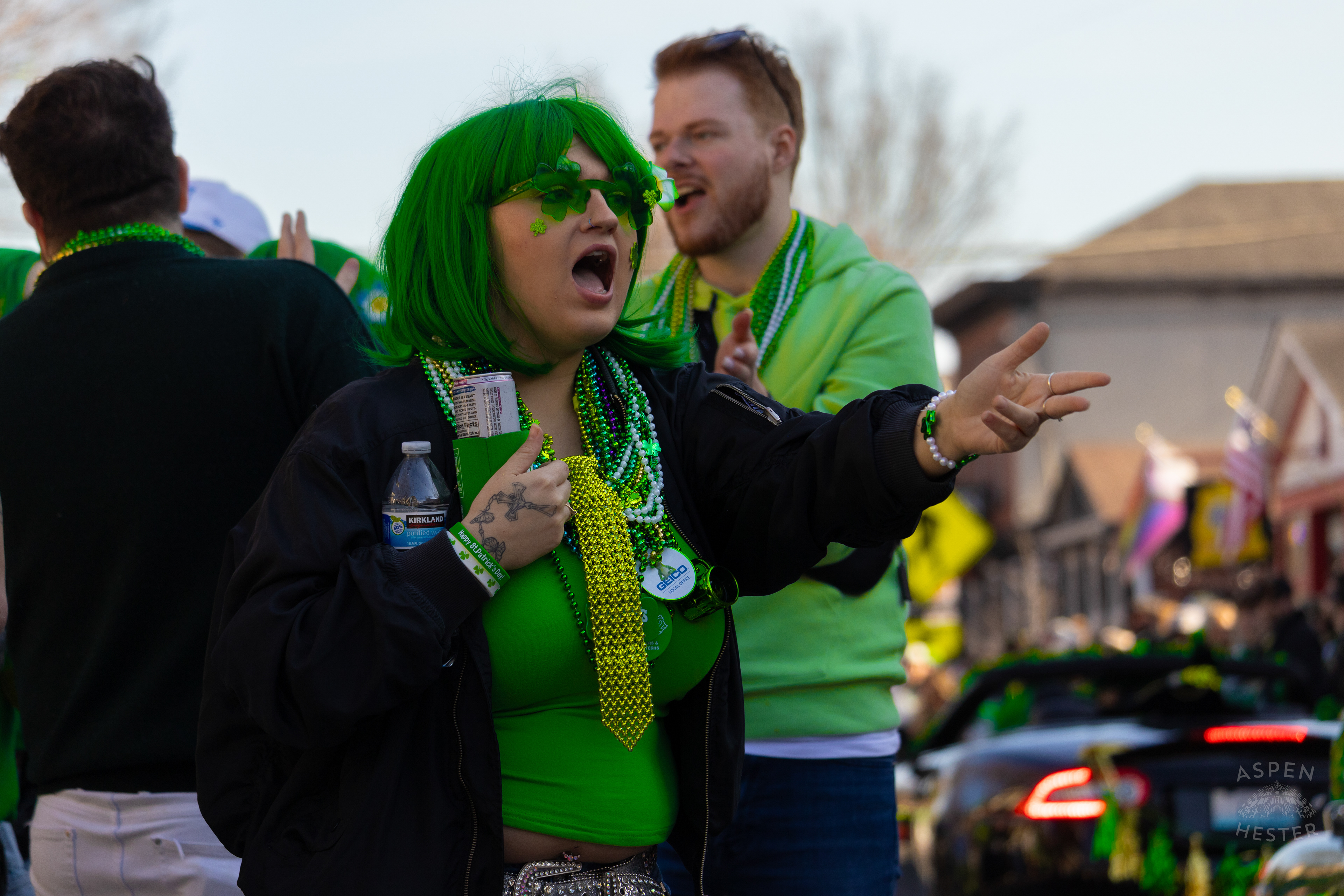 Spectator Decked Out in Green Yells for Beads as The 52nd Annual Saint Patrick’s Day Parade Rolls Through The Highlands. March 8th, 2025/Aspen Hester