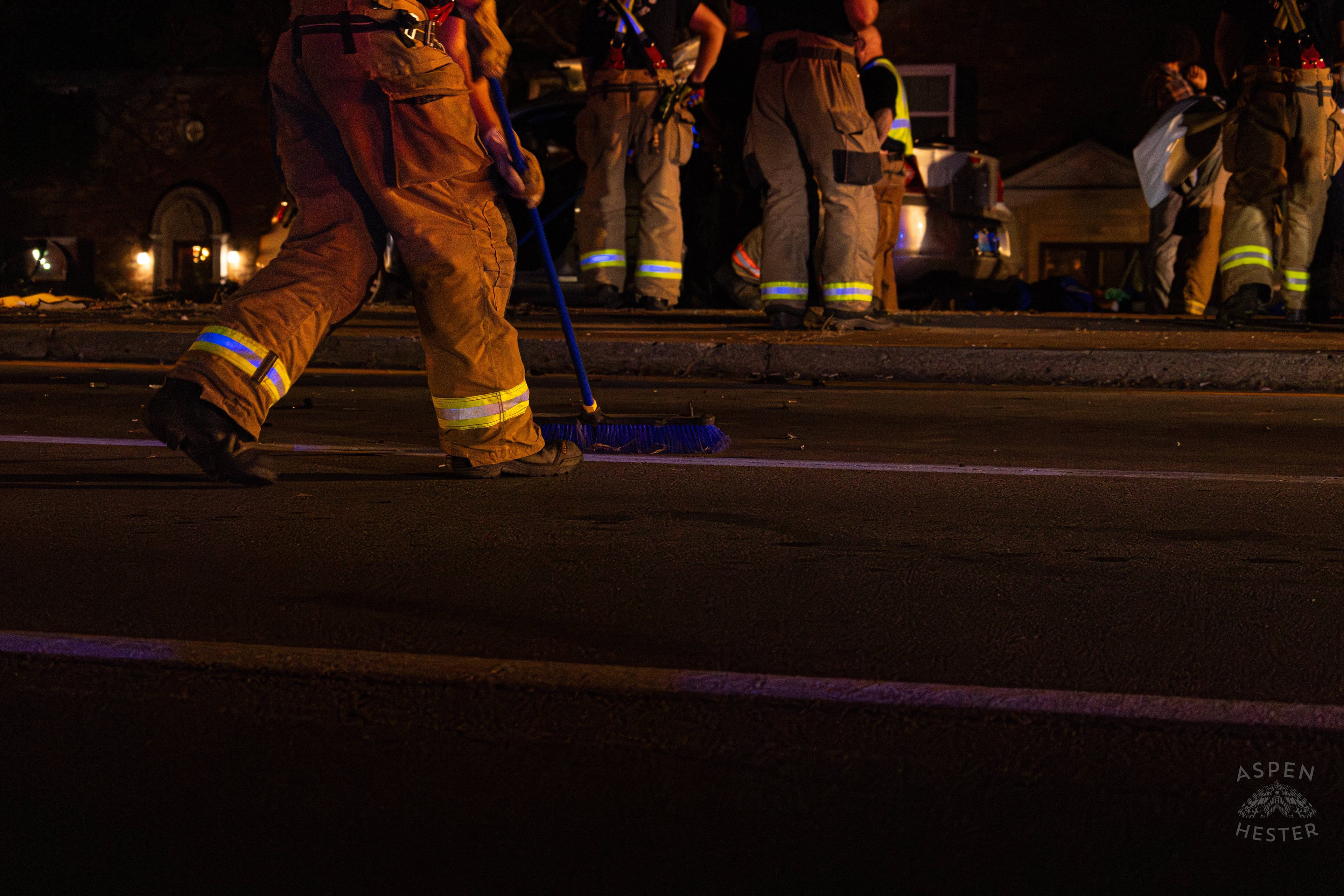 St. Matthews Firefighter Sweeping The Street so A Crew from Tony’s Wreckers Can Begin Removing The Piper Cherokee Plane from the Road after it Crash Landed, Taking Out Utility Poles, and Hitting A Car on Breckenridge Lane and Kresge Way. October 11th, 2024/Aspen Hester 