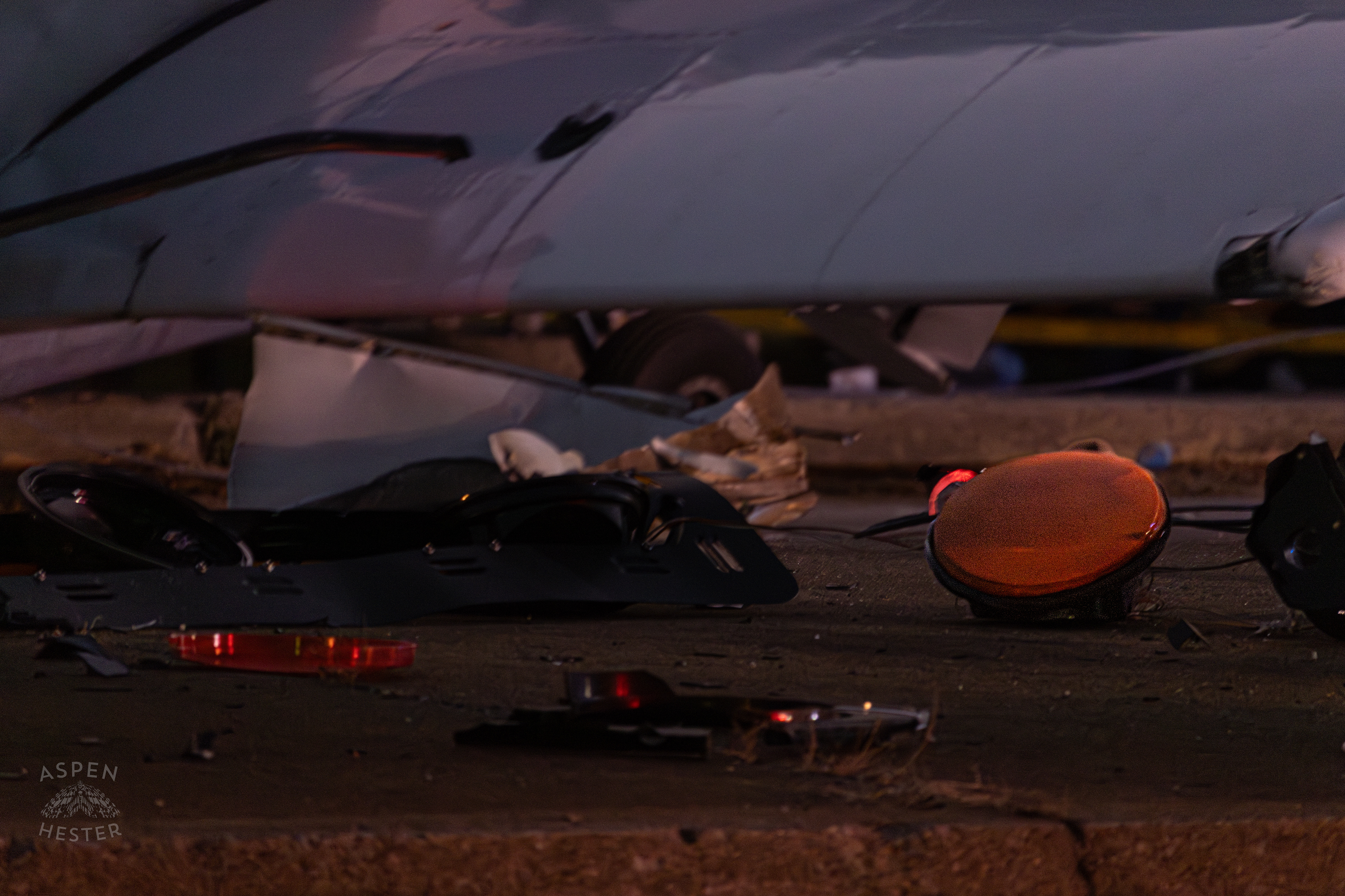 Pieces of A Stoplight Lay in The Road after A Piper Cherokee Plane Crash Landed, Taking Out Utility Poles, and Hitting A Car on Breckenridge Lane and Kresge Way. October 11th, 2024/Aspen Hester 
