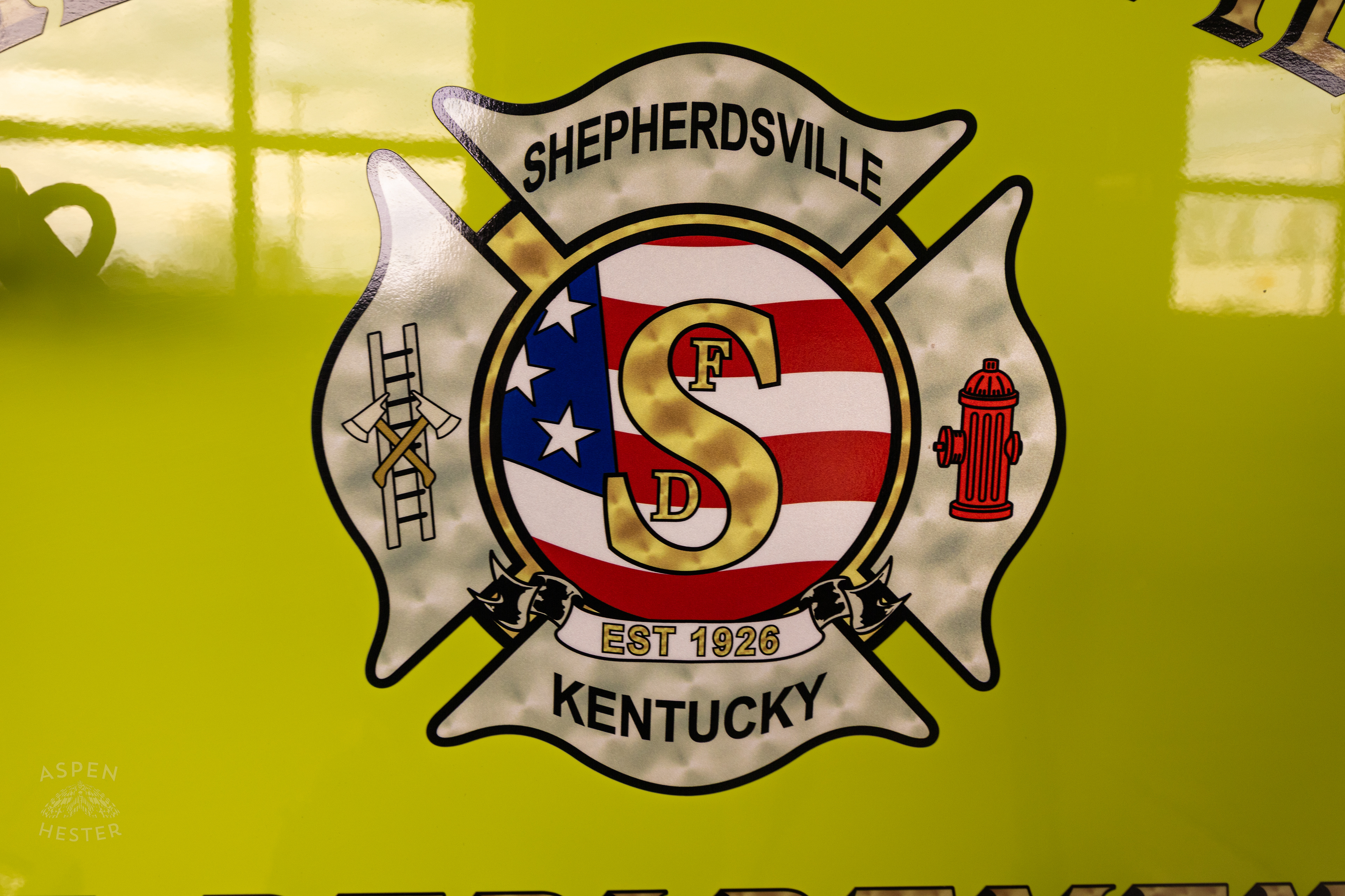 Shepherdsville Fire Department Seal Displayed on A Lime Green Fire Truck. November 17th, 2024/Aspen Hester