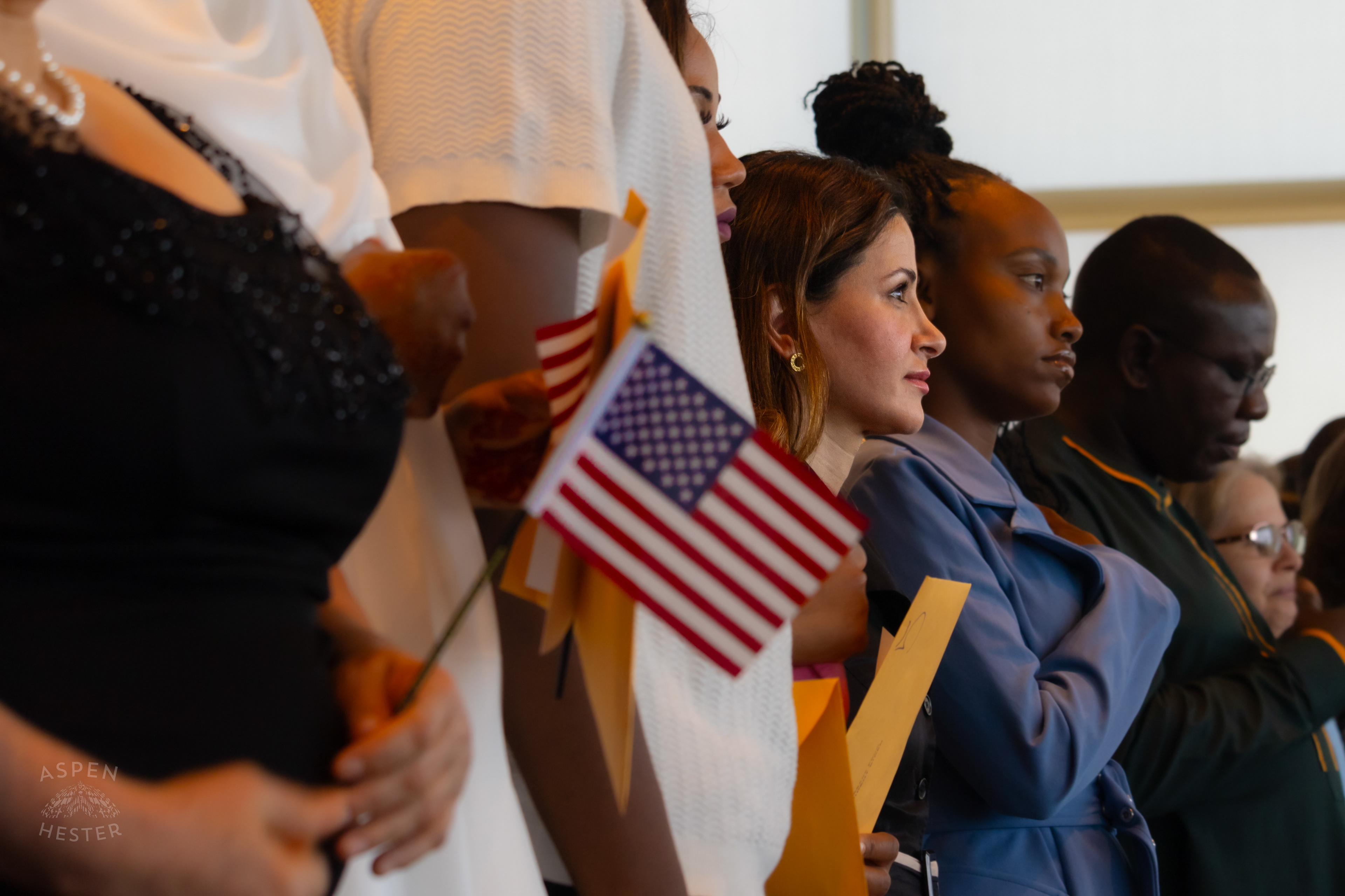 Migrants Say the Pledge of Allegiance for the First Time as American Citizens During WorldFest's Naturalization Ceremony. August 30th, 2024/Aspen Hester 
