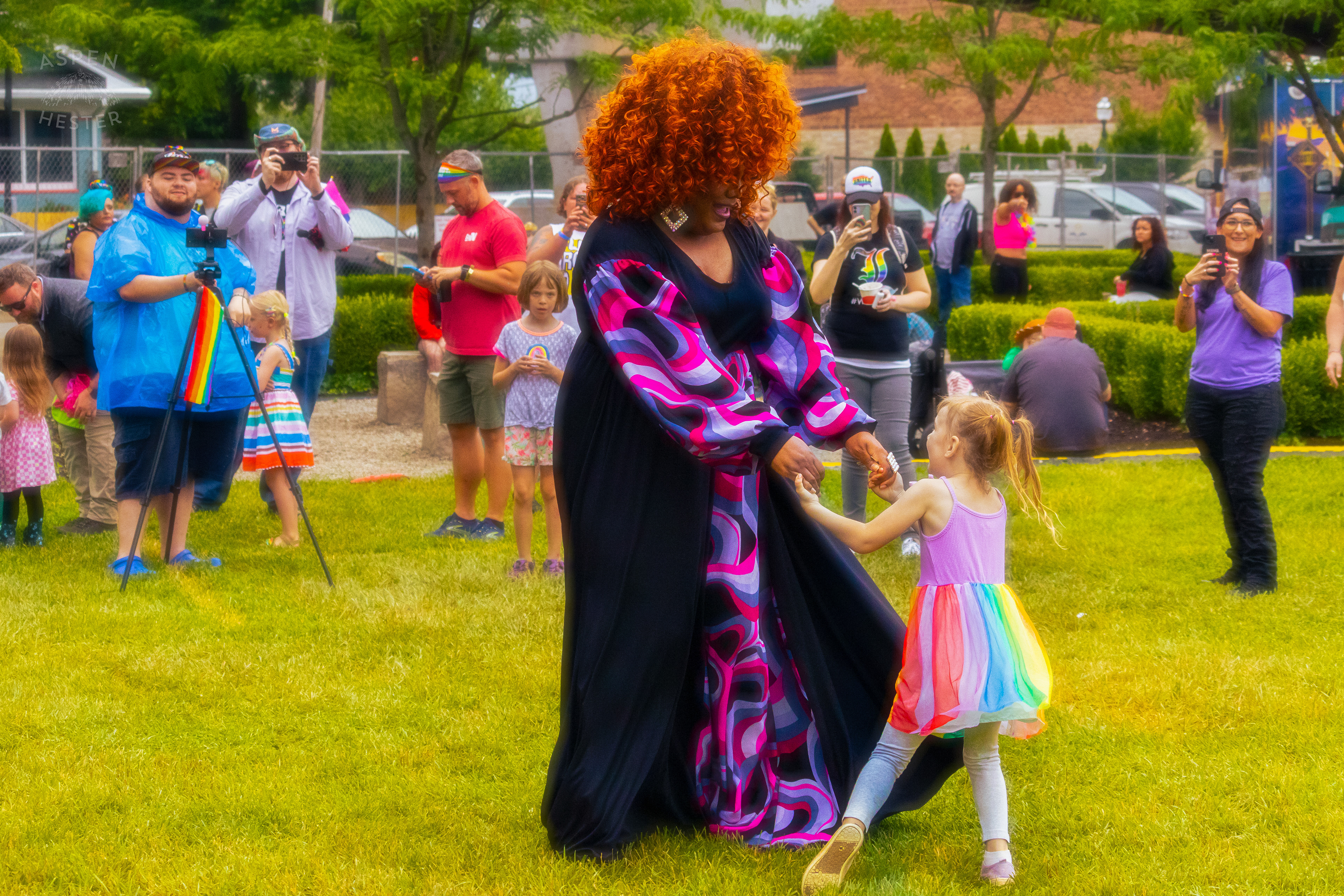 Drag Queen Dancing with A Kid from The Crowd While Performing 'Greatest Love of All' by Whitney Houston During Pride Bar's Family Friendly Drag Show at Southern Indiana Pride. June 1st, 2024/Aspen Hester