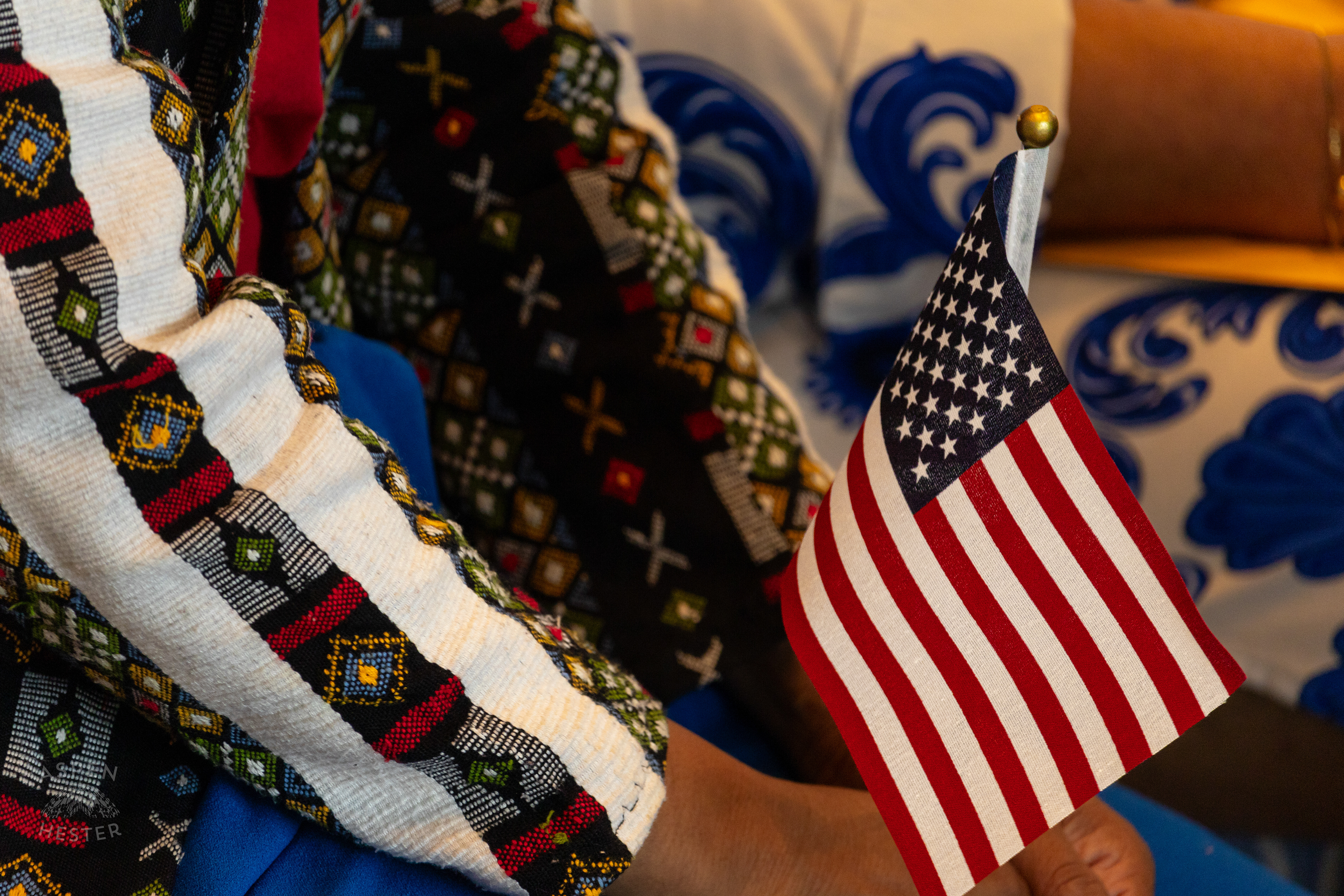 Migrants Holding American Flags at WorldFest's Naturalization Ceremony. August 30th, 2024/Aspen Hester