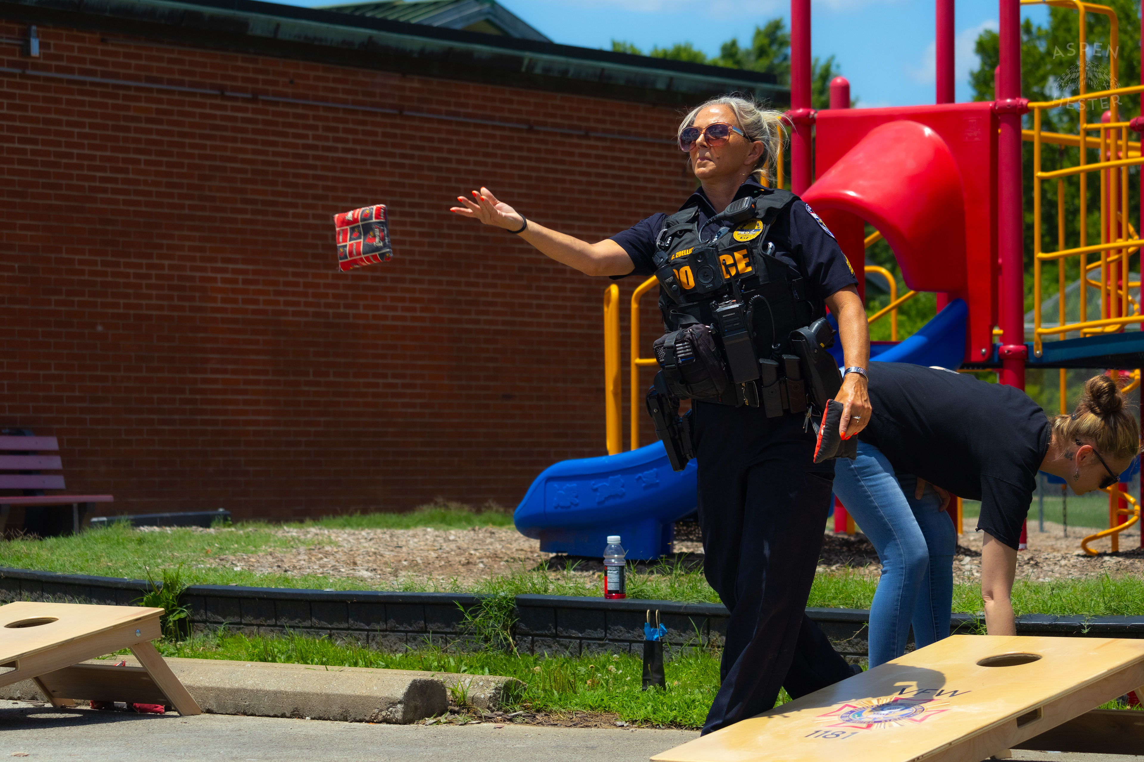 LMPD Officer Carmine Zoeller Participates in "Cornhole with Cops" Event. July 6th, 2024/Aspen Hester