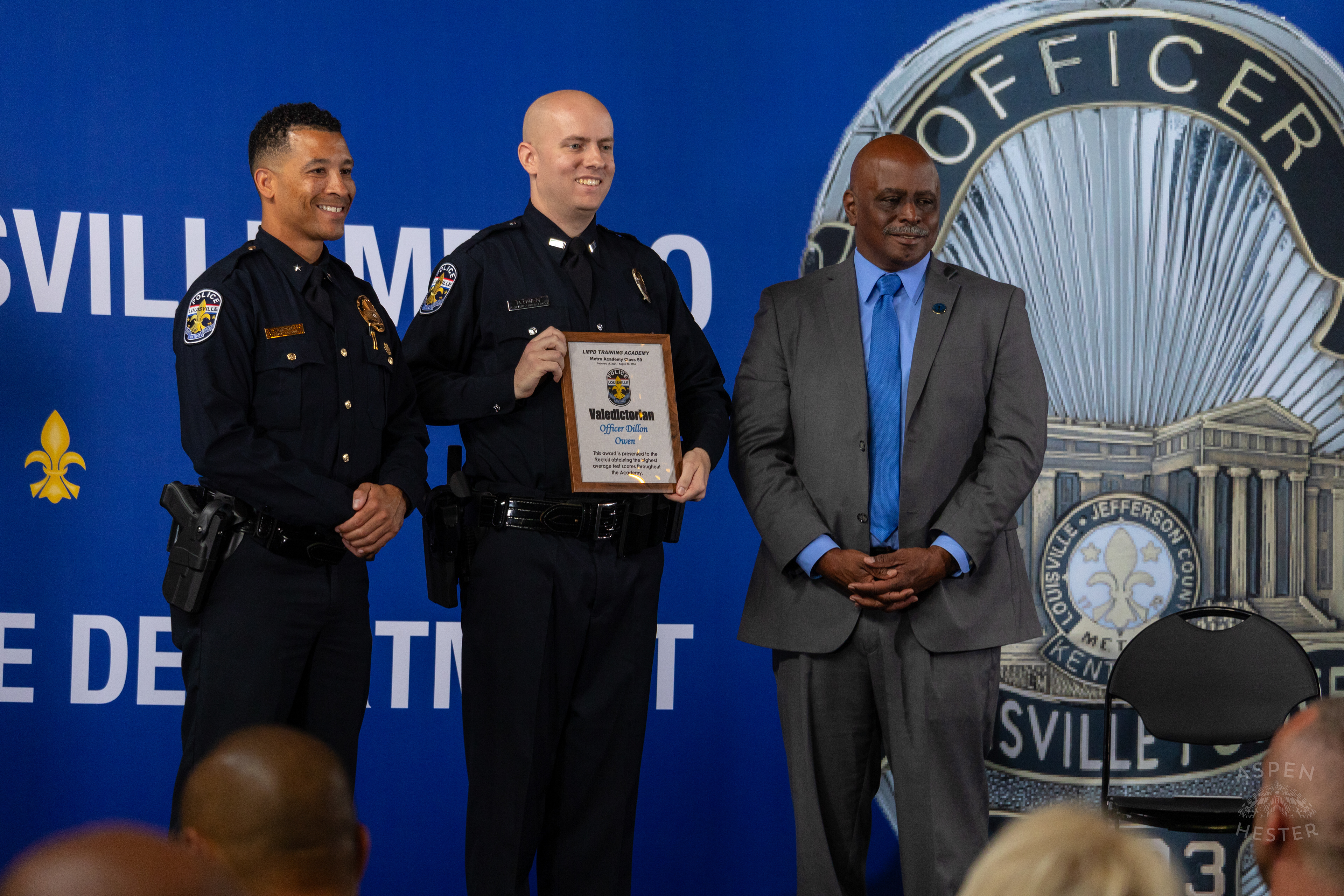 Paul Humphrey and David James with Graduating Officer Dillon Owen as he is Awarded Valedictorian at The Graduation of MAC 59 into LMPD. August 30th, 2024Aspen Hester