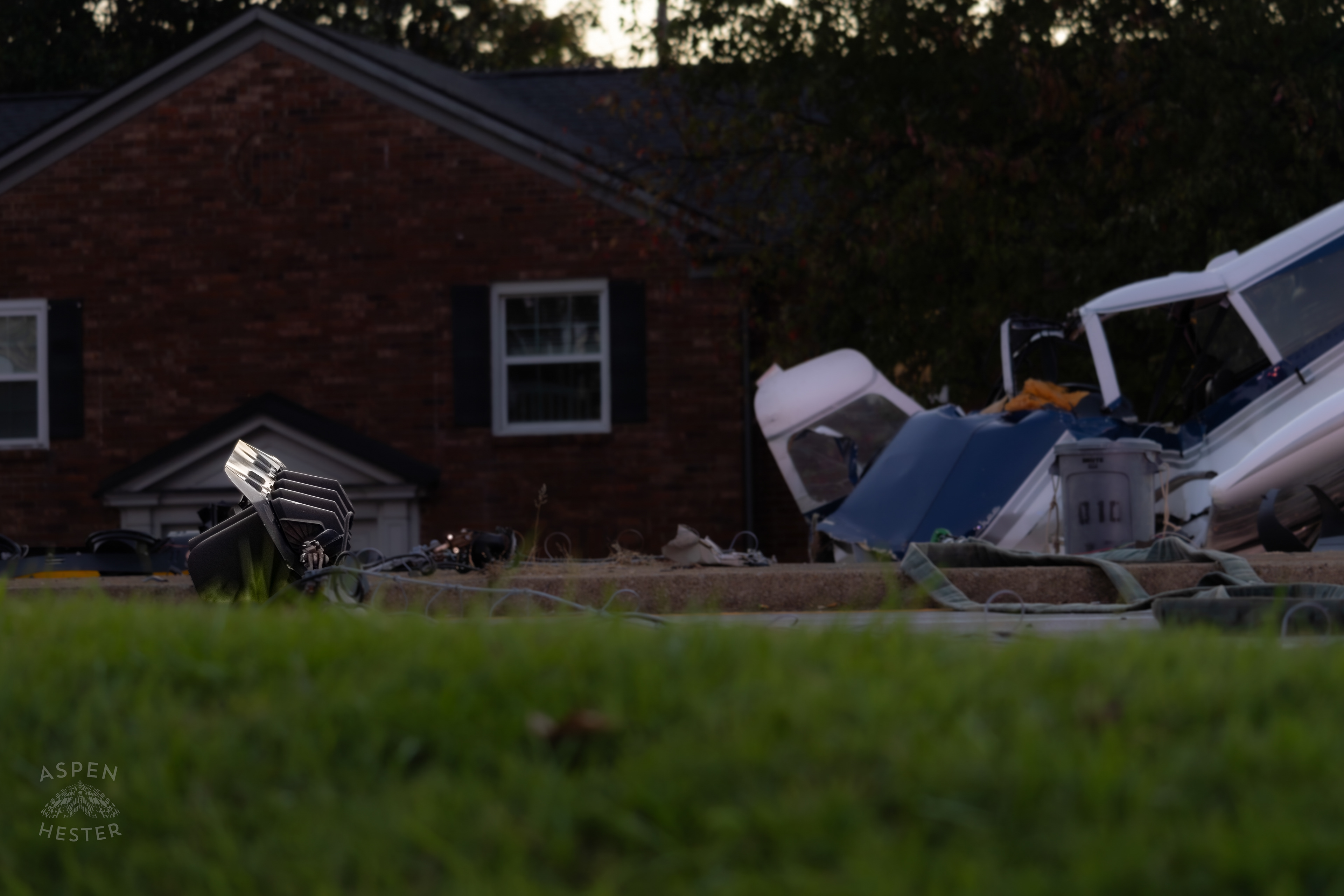 A Stoplight Lays in The Road after A Piper Cherokee Plane Crash Landed, Taking Out Utility Poles, and Hitting A Car on Breckenridge Lane and Kresge Way. October 11th, 2024/Aspen Hester 