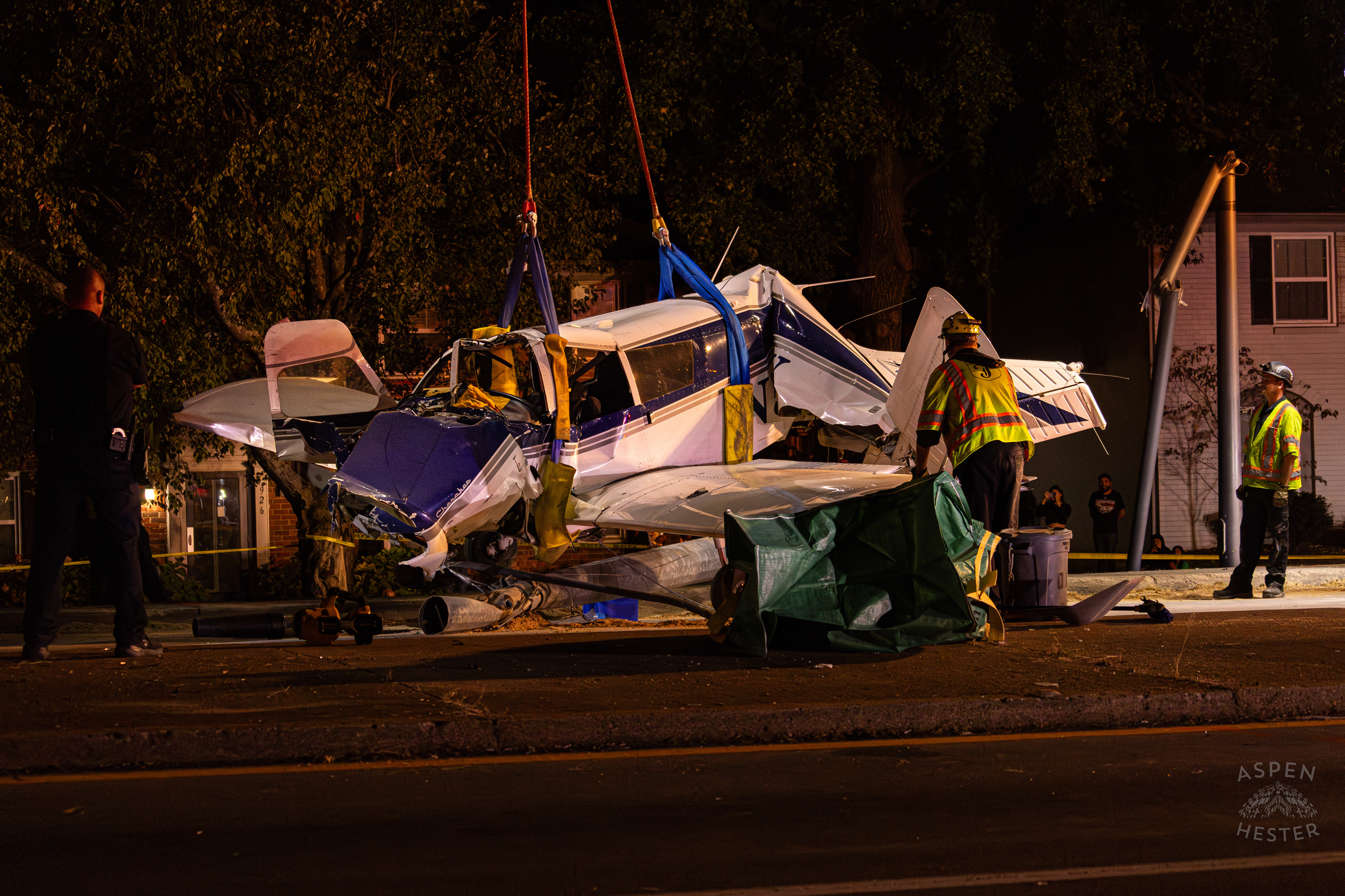 Tony’s Wreckers Crew Working to Remove The Piper Cherokee Plane from the Road after it Crash Landed, Taking Out Utility Poles, and Hitting A Car on Breckenridge Lane and Kresge Way. October 11th, 2024/Aspen Hester 
