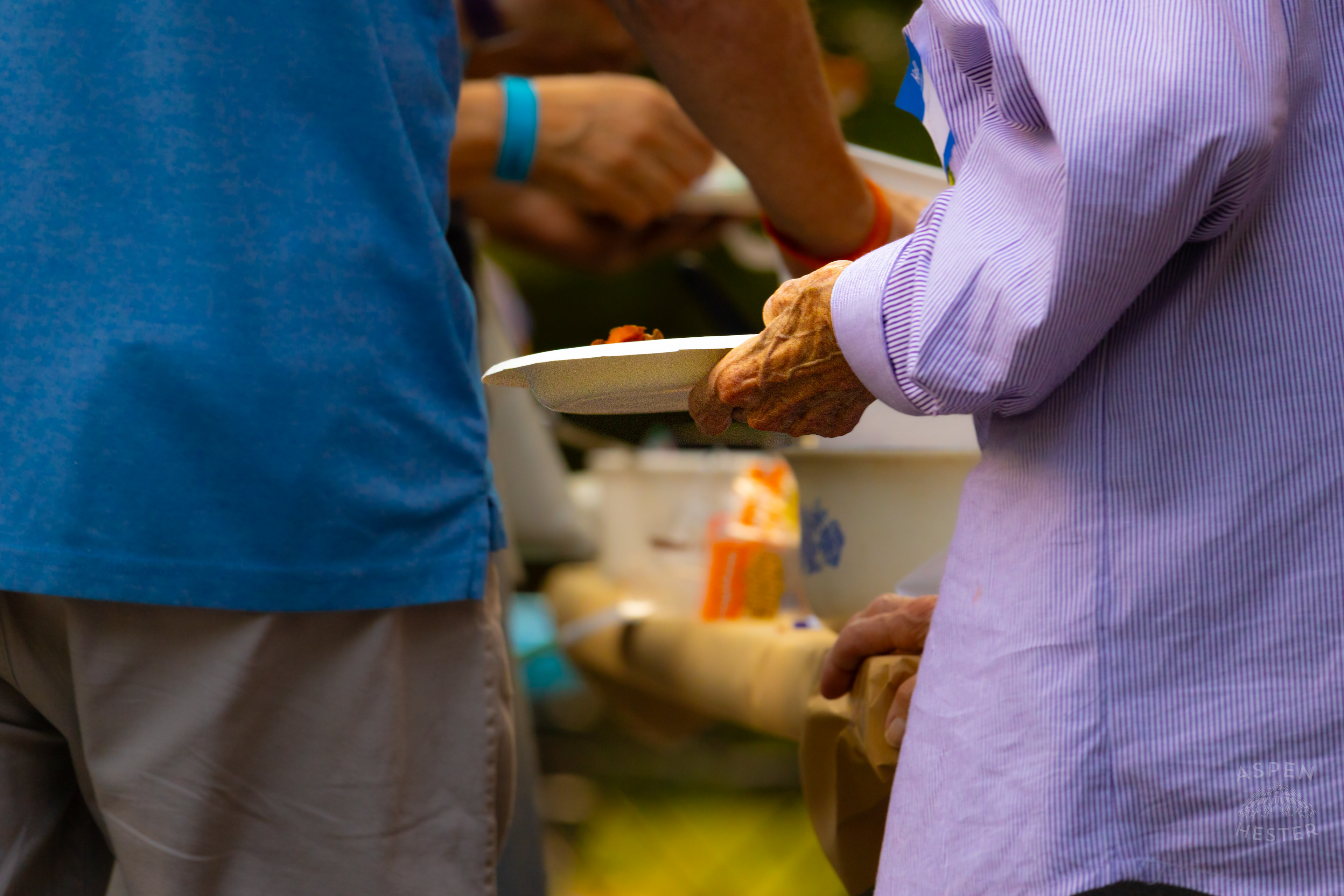 Someone Filling Their Plate from The Big Table at Iroquois Park. September 15th, 2024/Aspen Hester 