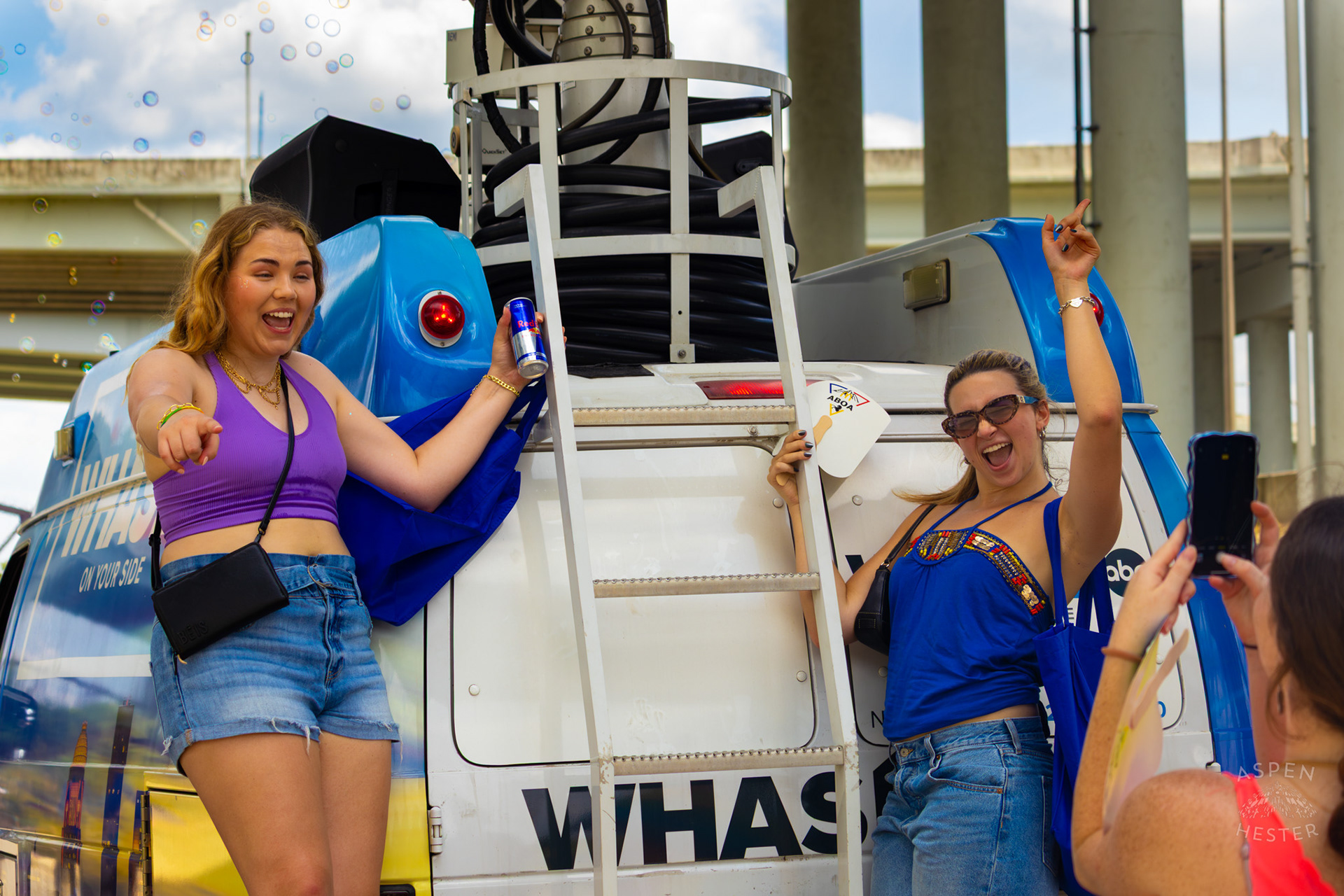 WHAS-11’s Alexandra Goldberg and Cam Kauffman Pose On The Back of The Satellite Truck During The Annual Parade at Kentuckiana Pride 2025. June 21th, 2025/Aspen Hester 
